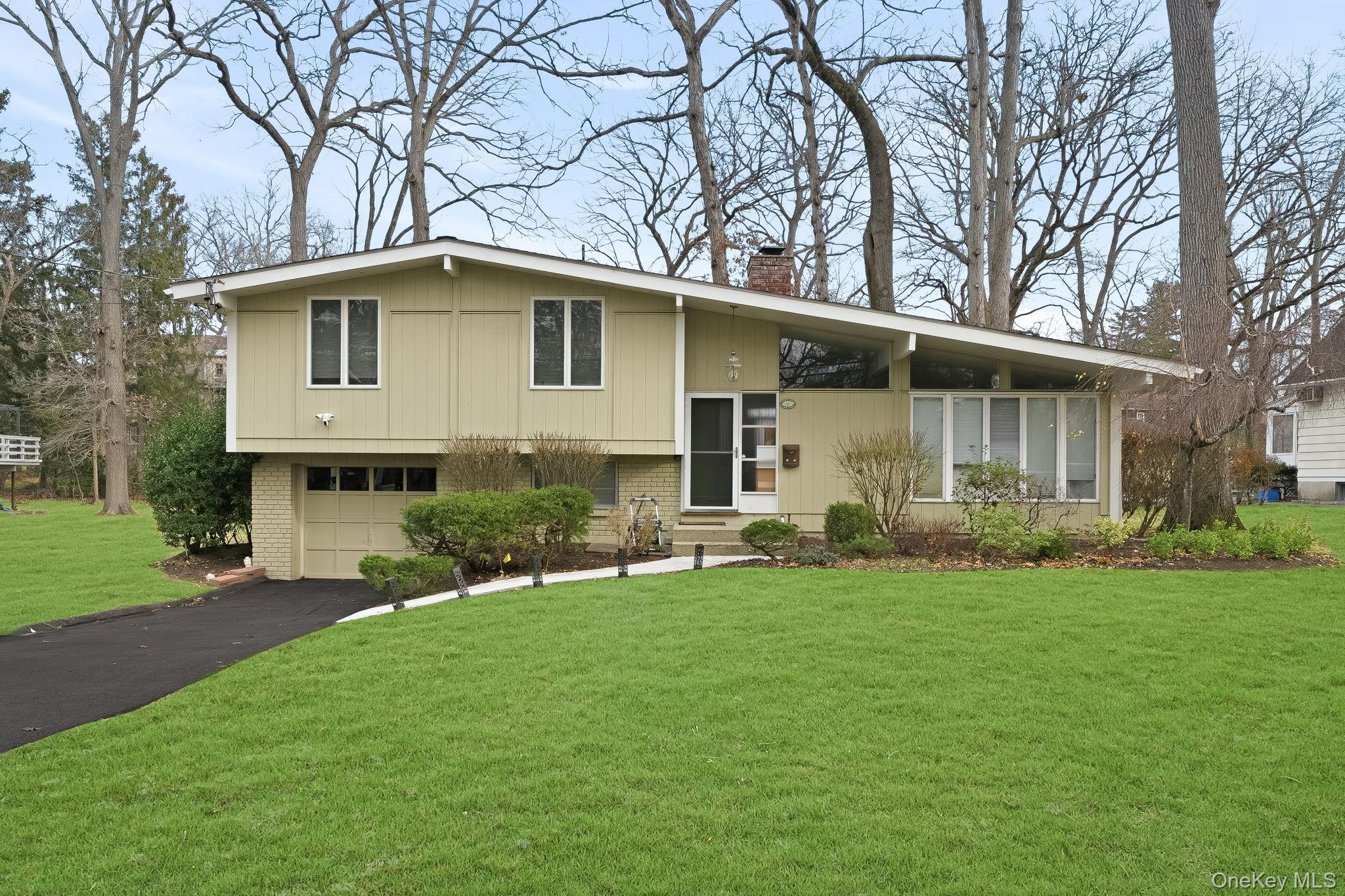 This stylish Contemporary Split home in the coveted Prospect Park neig...