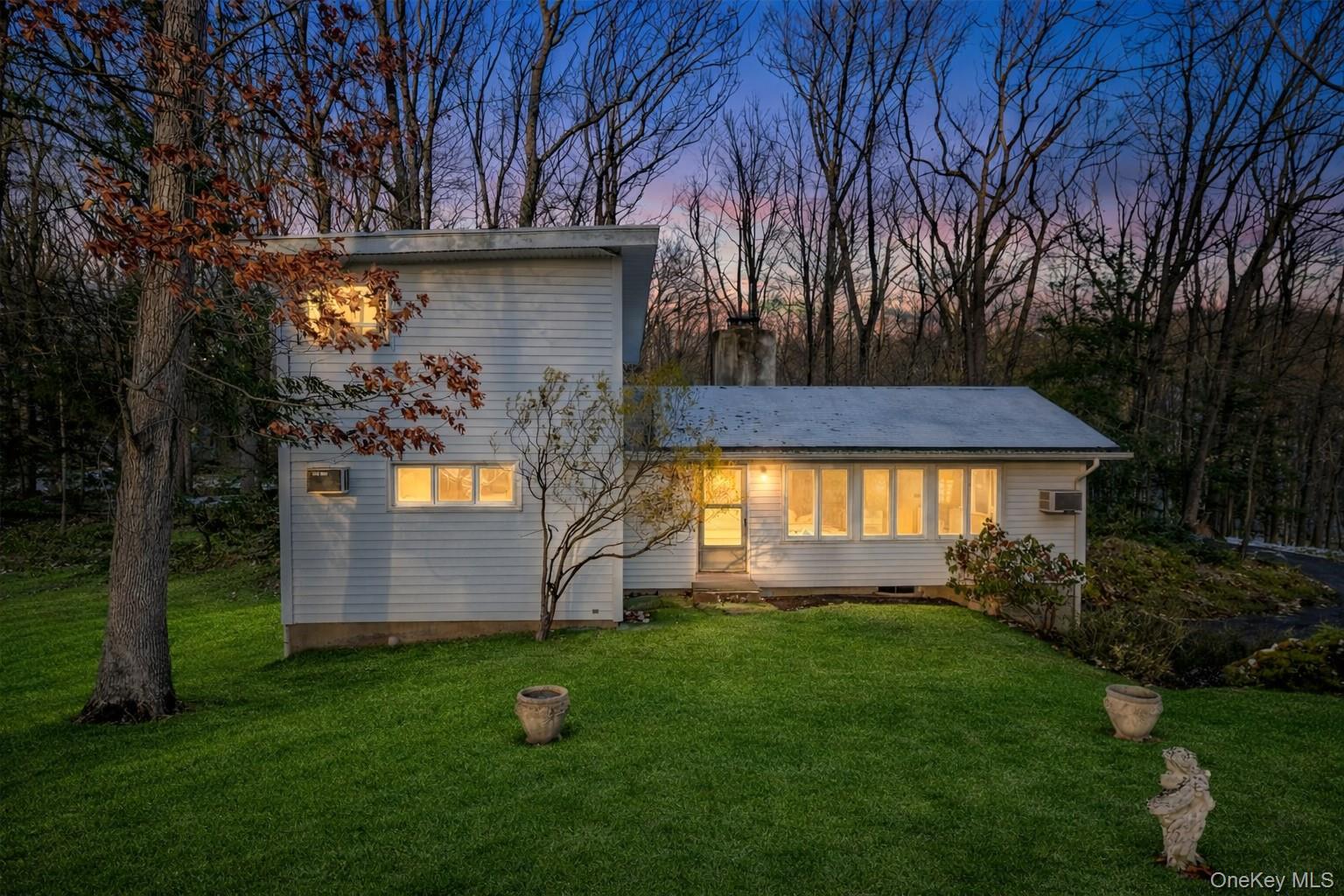 One of the most beautiful settings in Huntersville. Sprawling property...