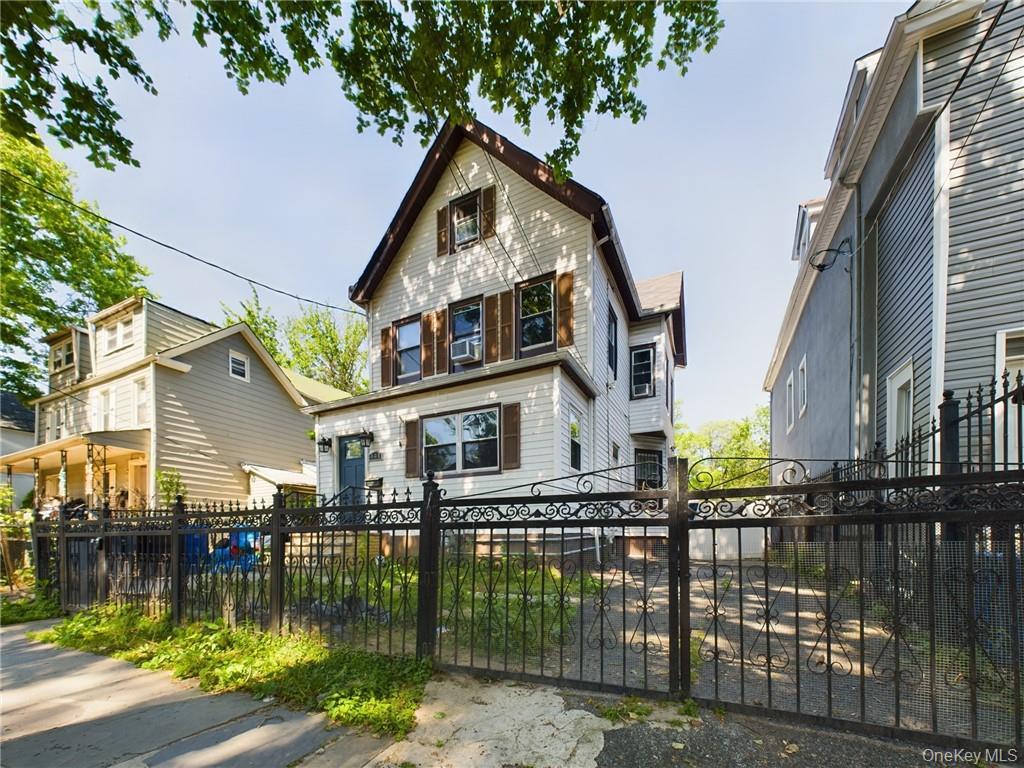 Fully detached two-family home featuring a 4-bedroom/1-bath unit over...