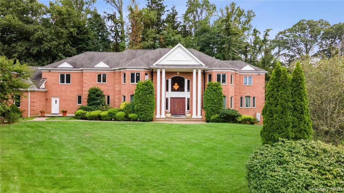 I am pleased to present this stunning custom-built brick Colonial home...
