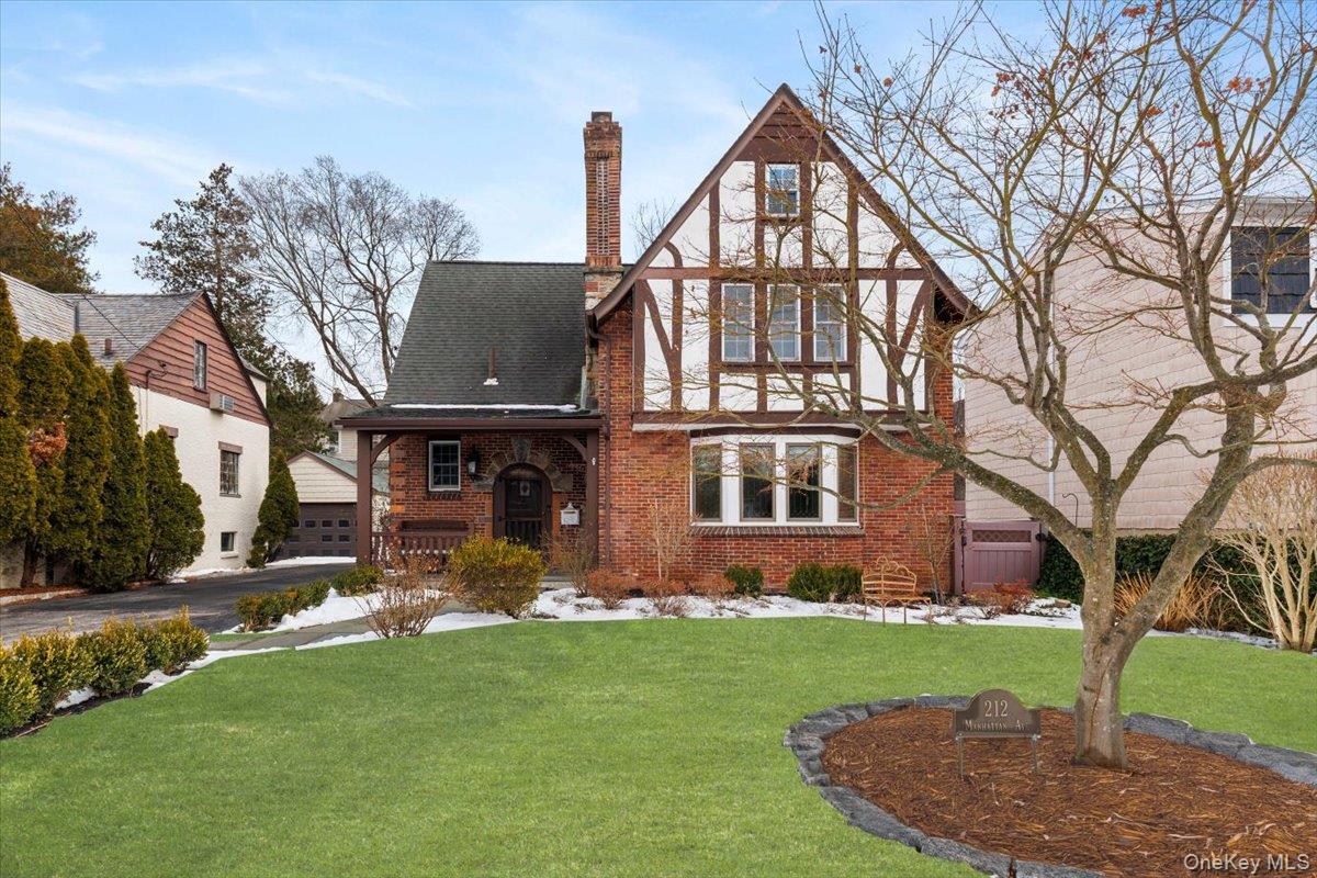 Beautiful Crestwood Tudor set on a quiet cul-de-sac. This inviting hom...