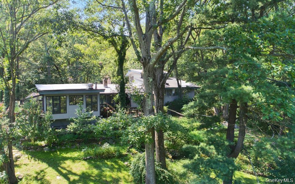 Tucked away on 5.6 breathtaking acres in the Village of Scarsdale, thi...