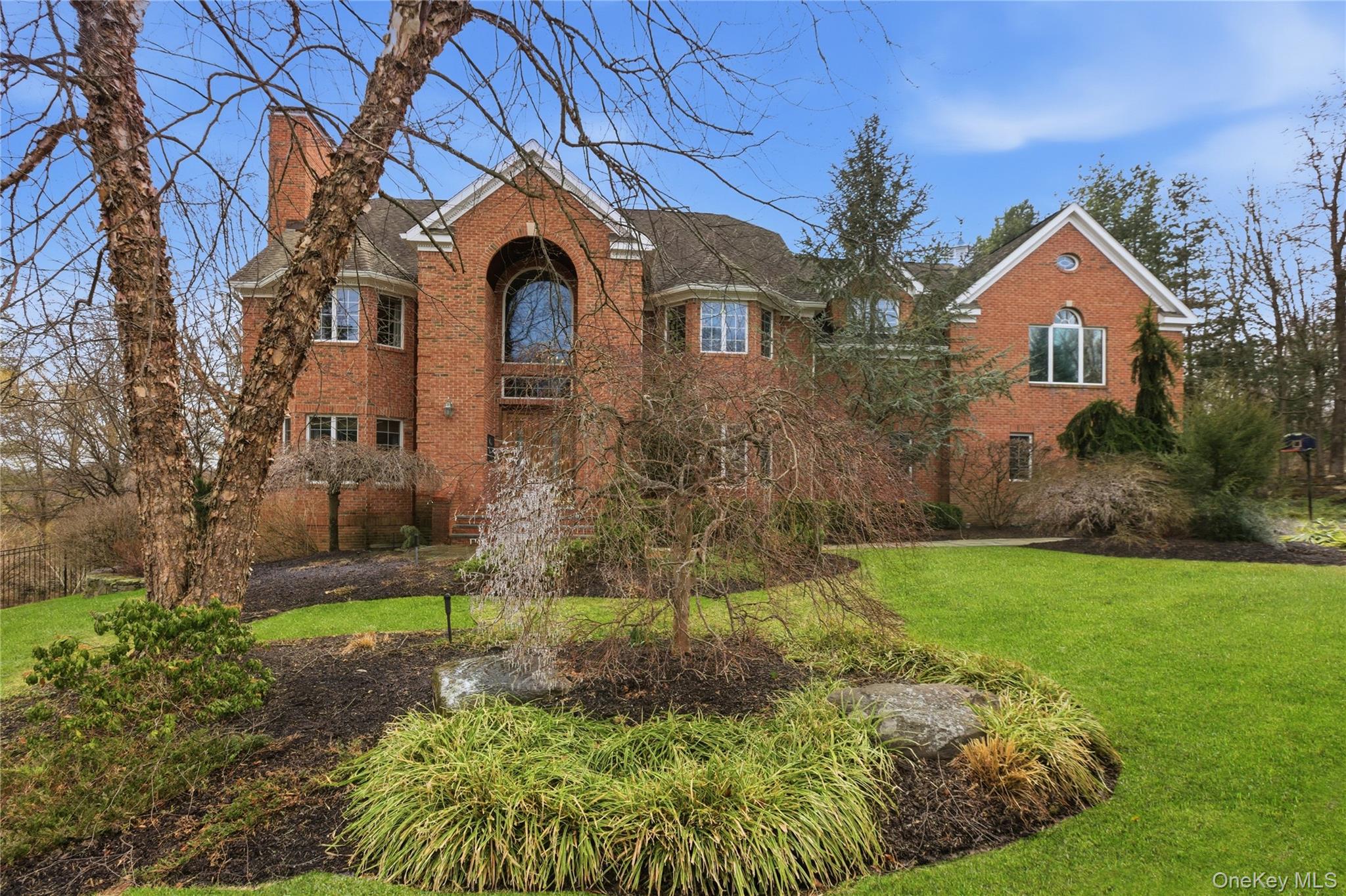 Welcome home to this stately brick center-hall colonial that takes you...