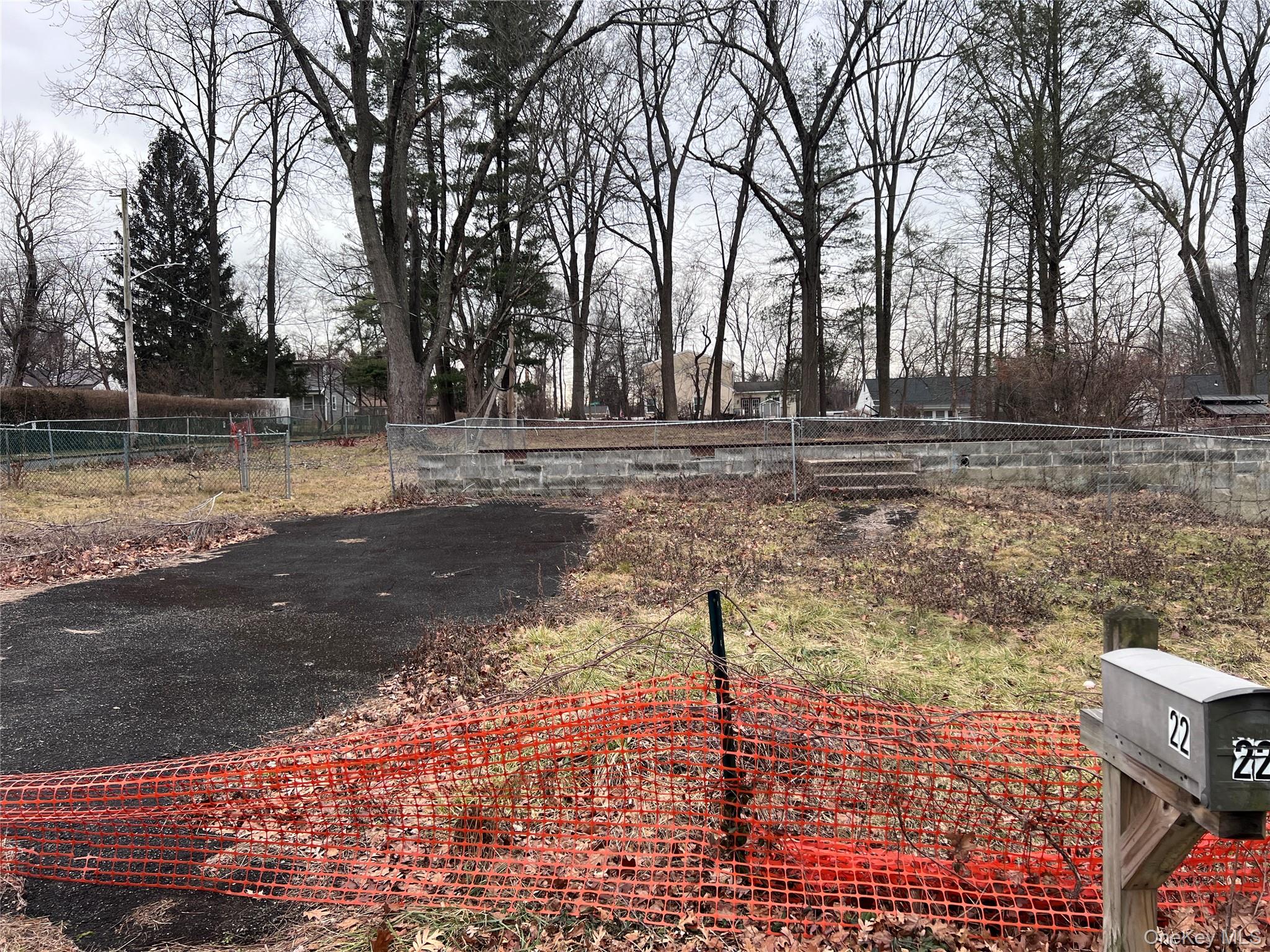 Corner building lot with foundation and connections to street utilitie...