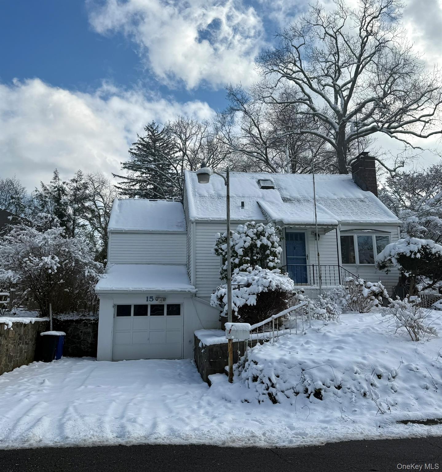 Charming Cape Cod with an open-concept layout featuring a bright livin...