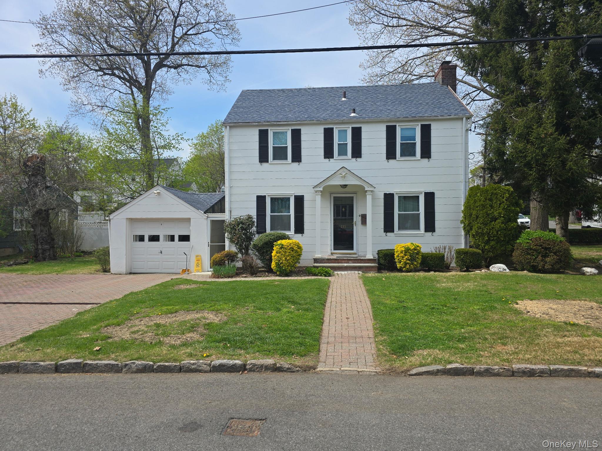 Freshly painted Colonial home features an open floor-plan kitchen equi...