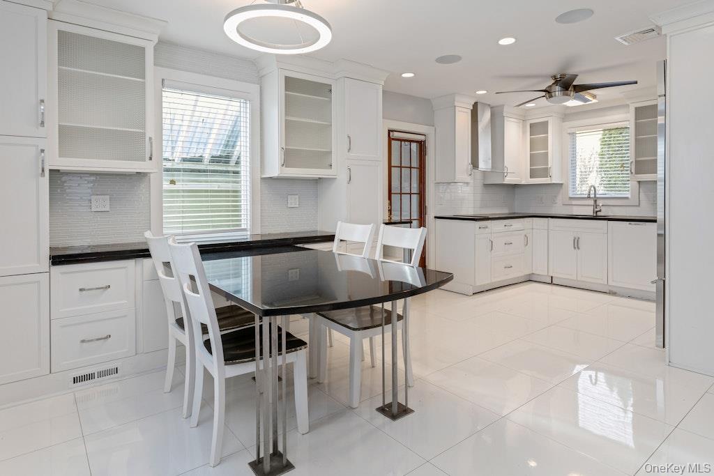 This beautiful Colonial home features an open floor-plan kitchen equip...