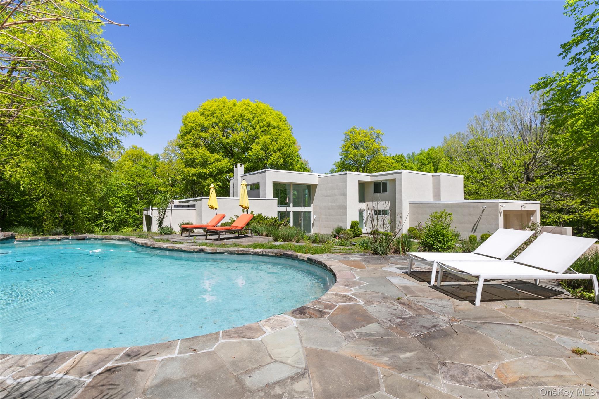 Set high on a hill overlooking the Pound Ridge Reservation, 71 Old Sto...