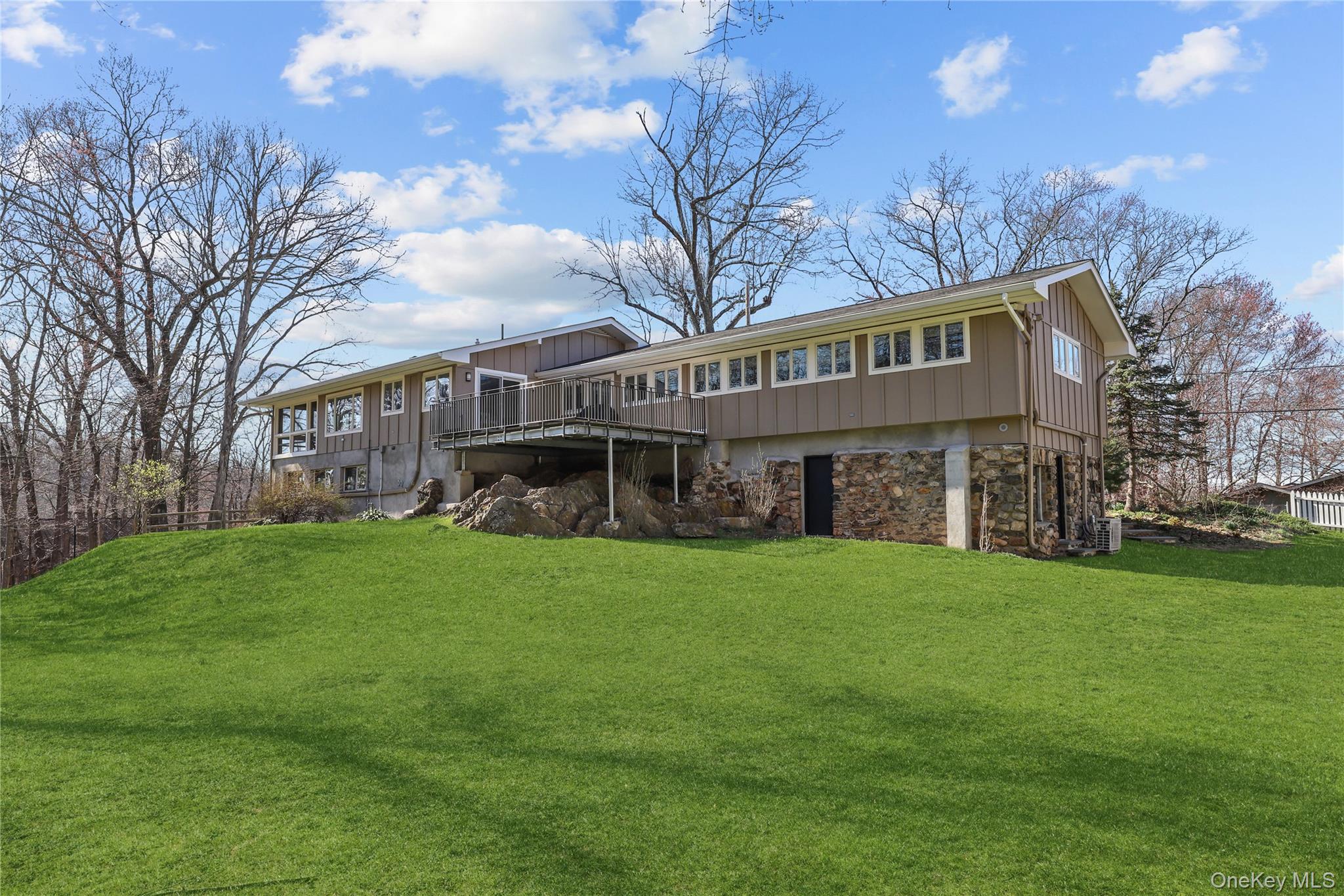 Live the Lake Katonah life in this spacious, fully renovated mid-centu...