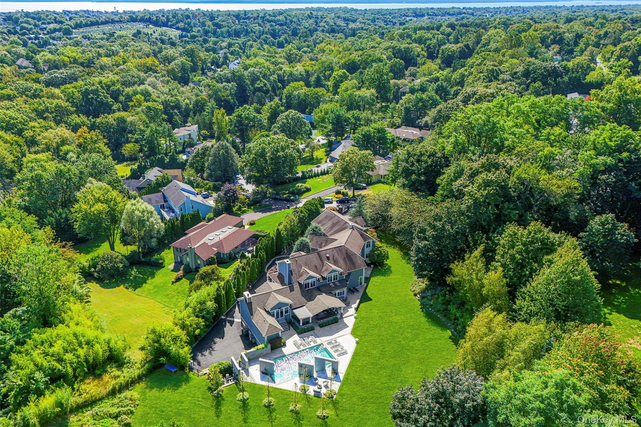 This contemporary colonial is a true testament to grandeur, privacy, a...