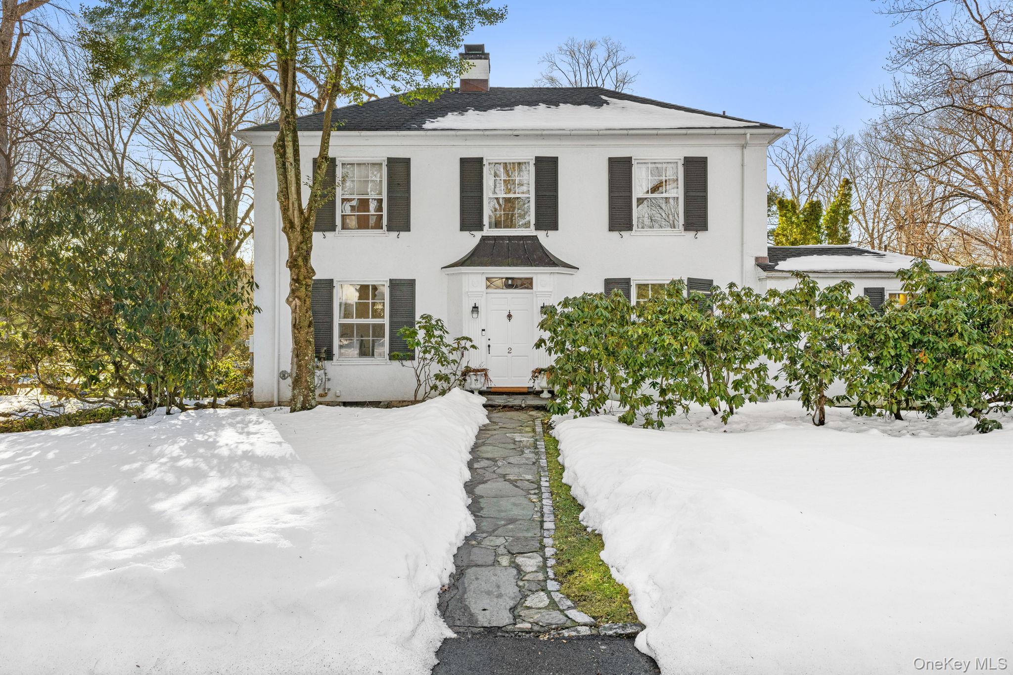 Nestled on a quiet cul-de-sac, 2 Apple Tree Close is a rare 1930s Colo...