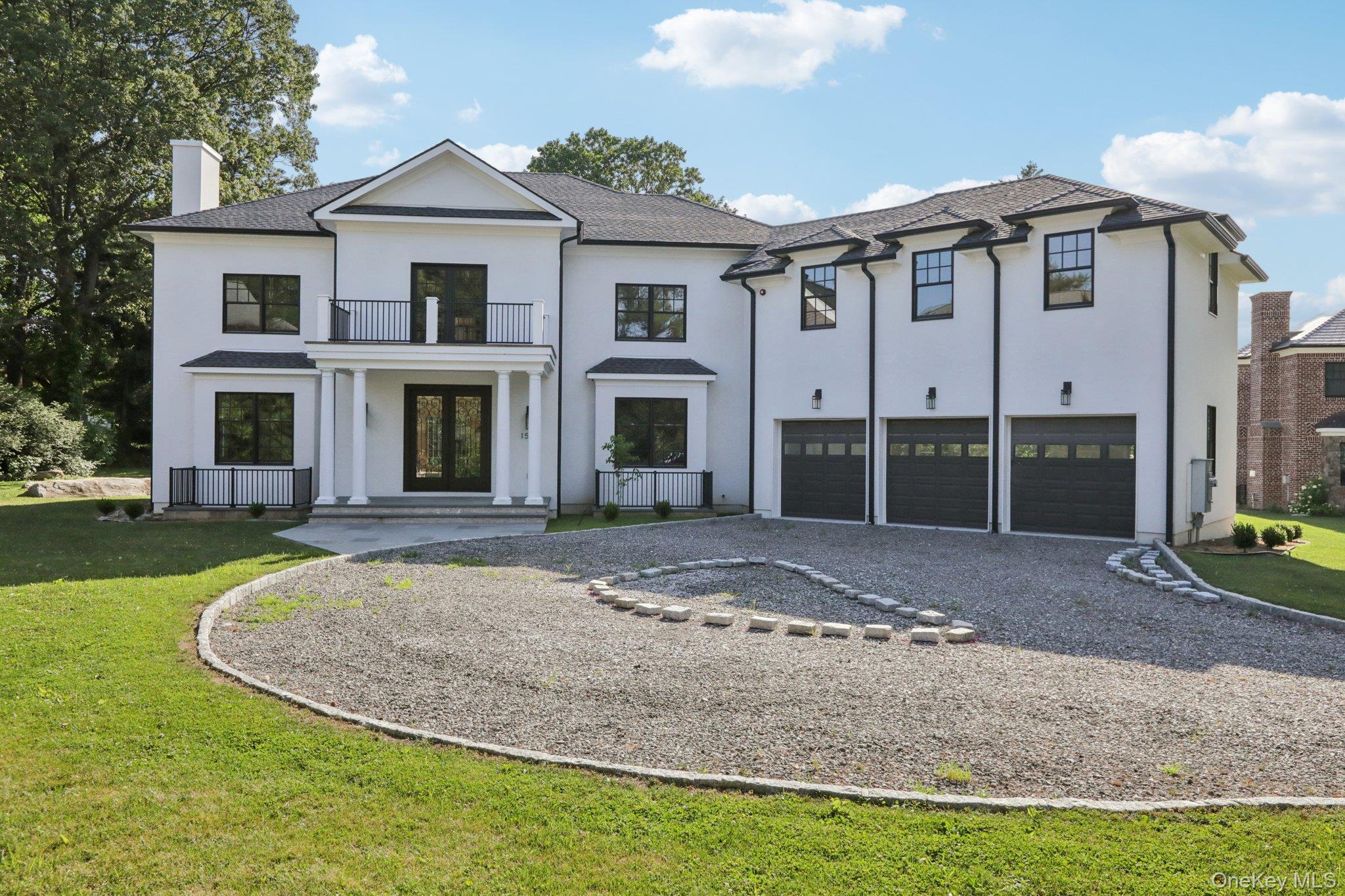 Commanding curb appeal and timeless architecture define this exception...