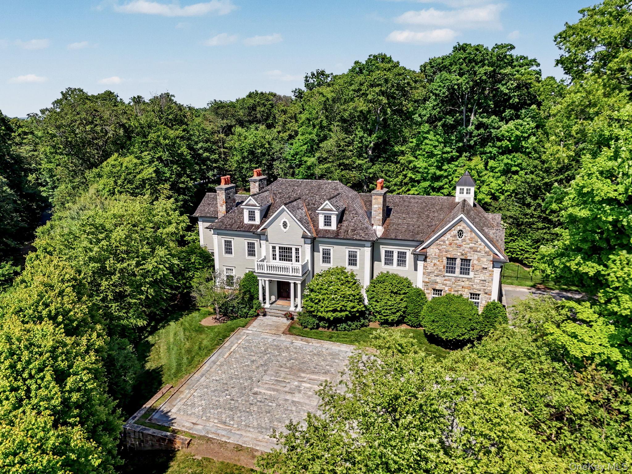Privately set along a winding drive in the coveted Gifford Lake enclav...