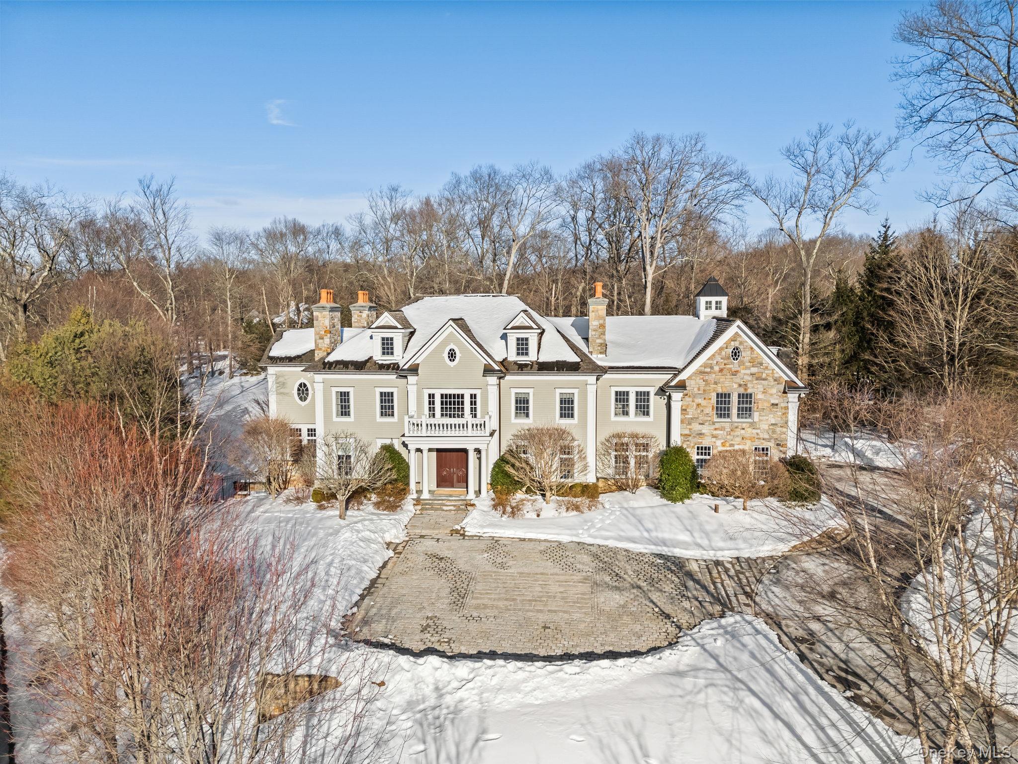 Privately set along a winding drive in the coveted Gifford Lake enclav...