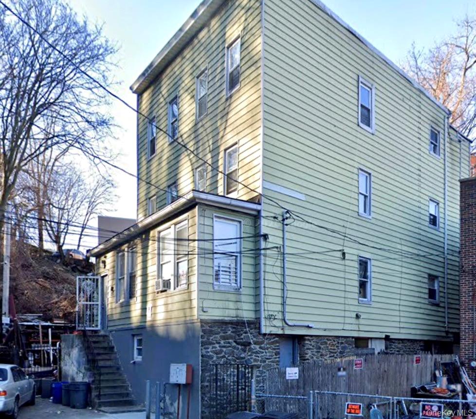 Fully occupied 3-family investment property generating over $5,800 per...