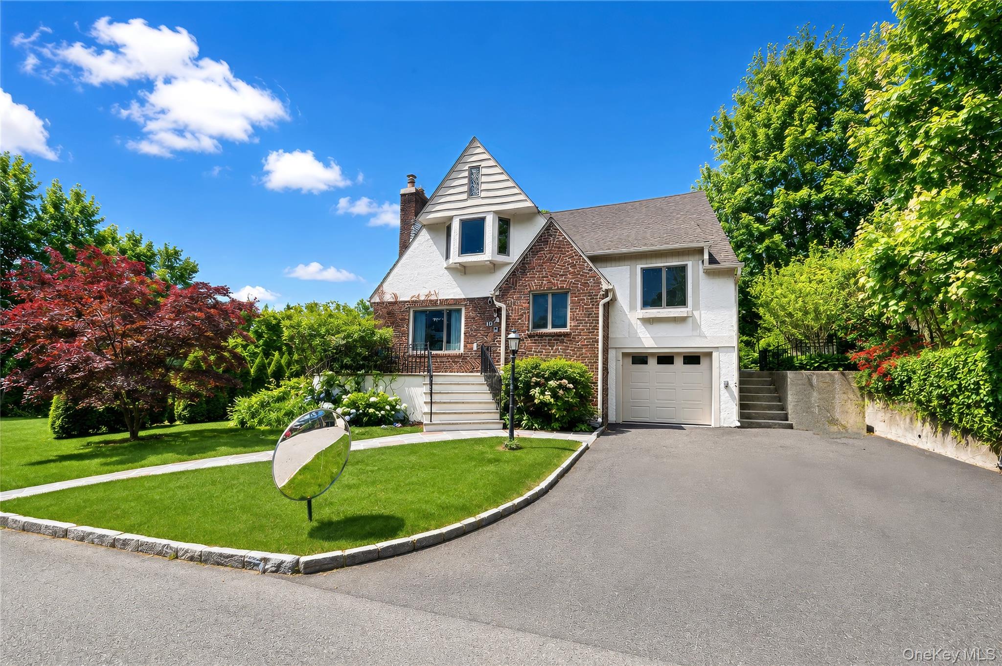 Welcome to 10 Cherry Ave, a beautifully updated Tudor nestled in the c...