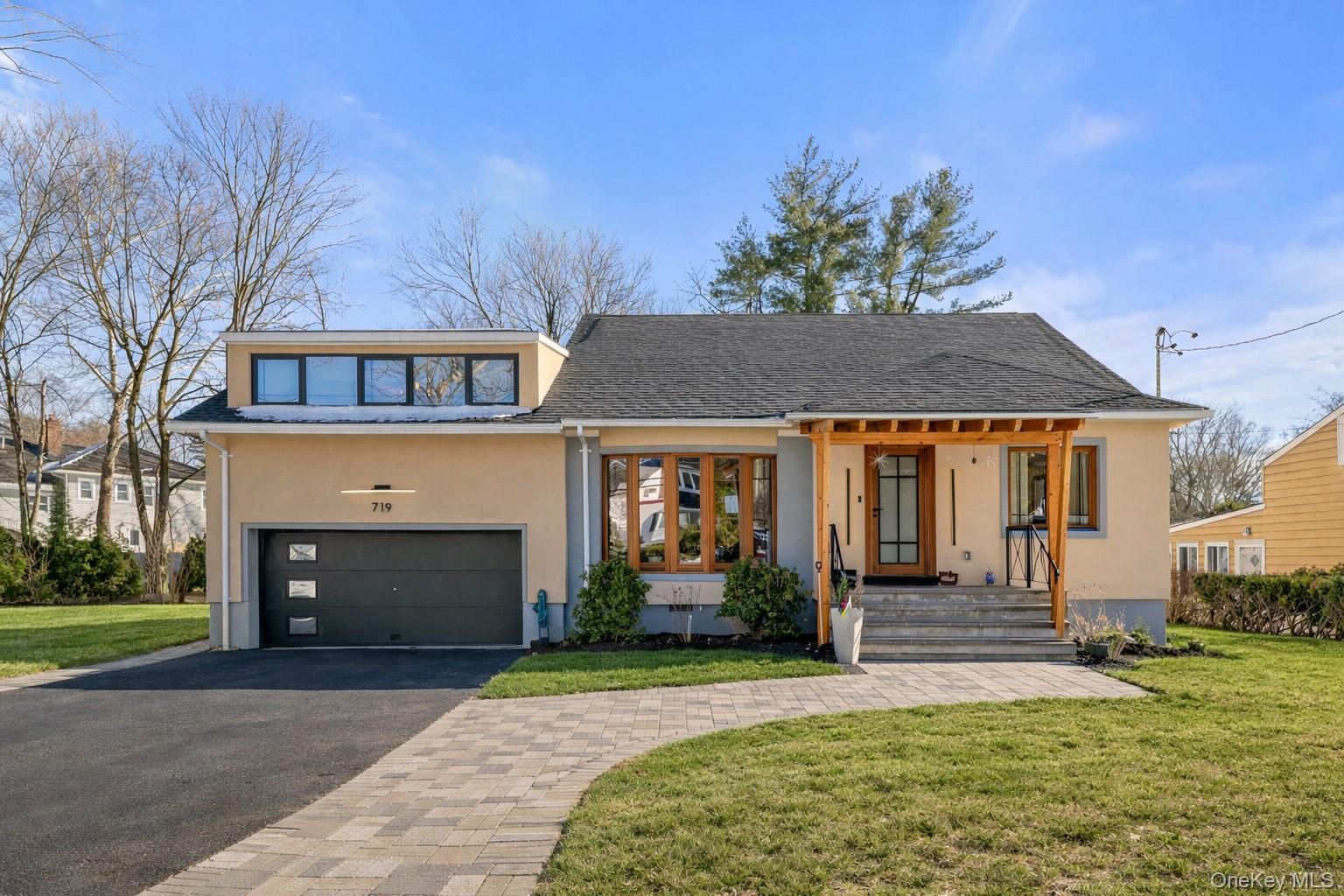Experience an architectural rebirth in this gut-renovated Scarsdale re...