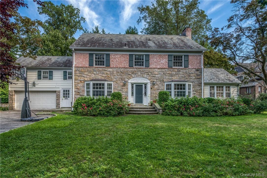 Ideally located on prominent street in the north end, this classic bri...