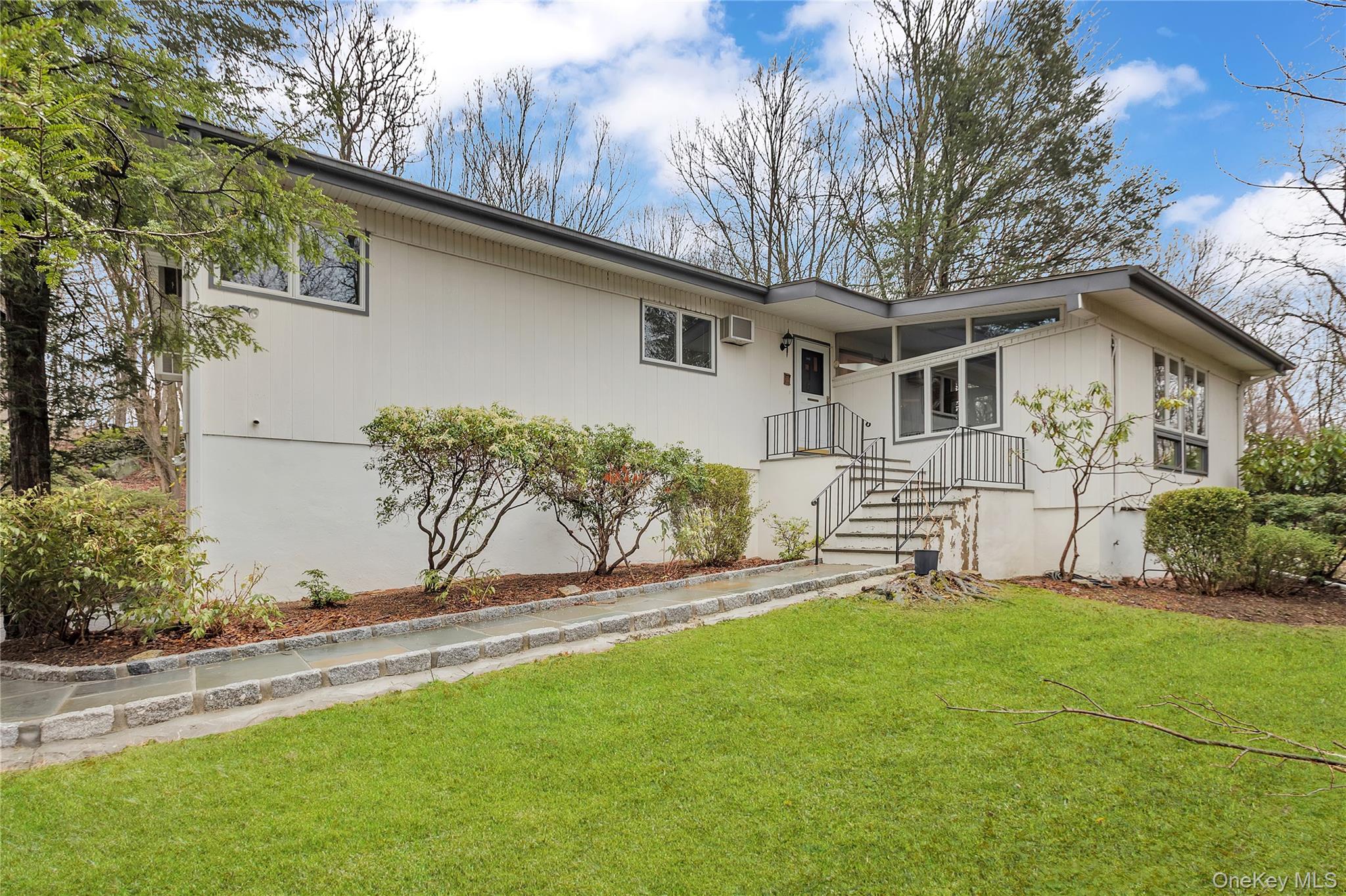 Modernist living meets woodland privacy. This unique Mid-Century Moder...