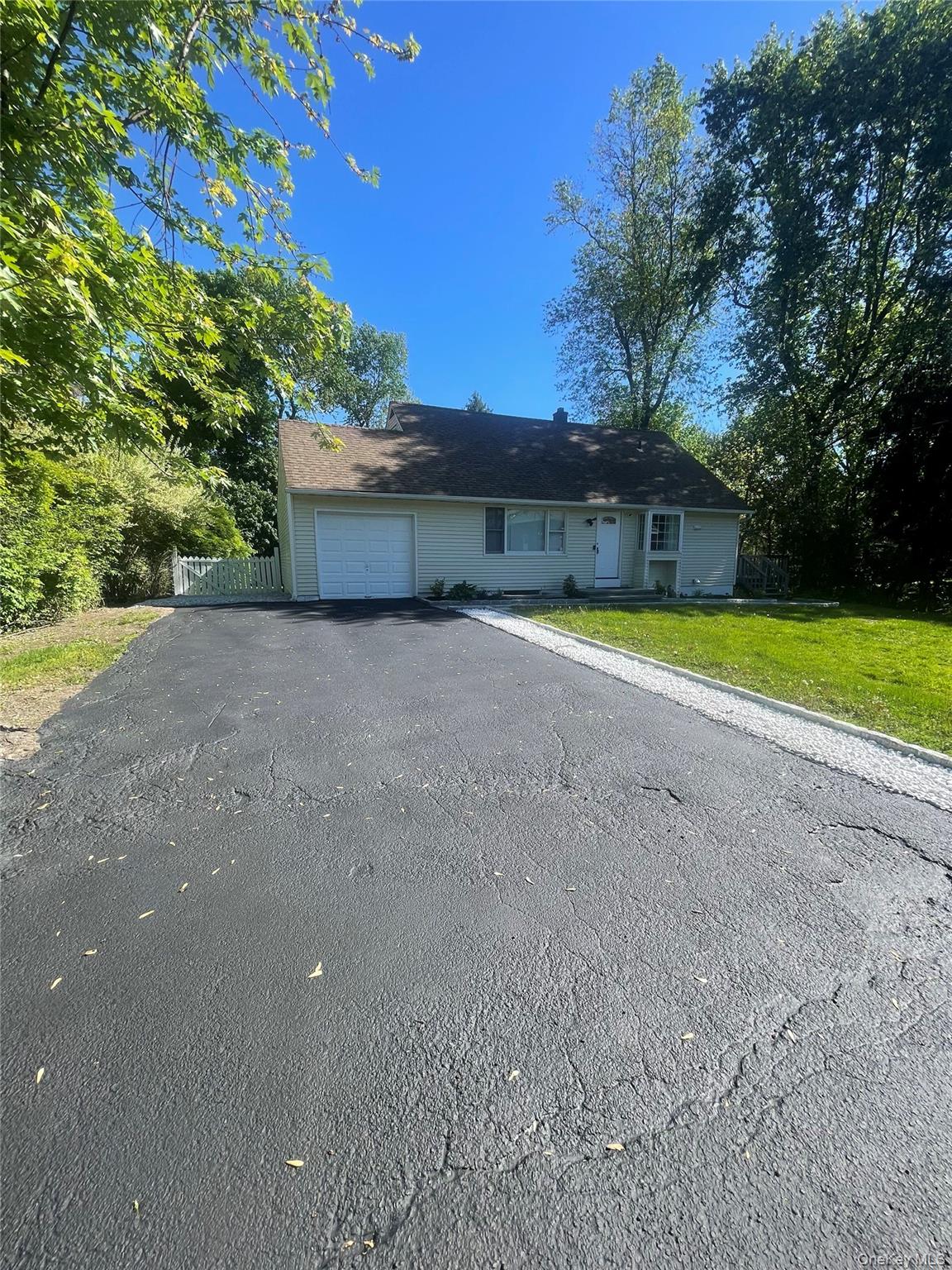 Nestled along a picturesque, tree-lined street on more than a quarter...