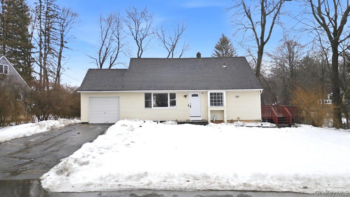 Nestled along a picturesque, tree-lined street on more than a quarter...