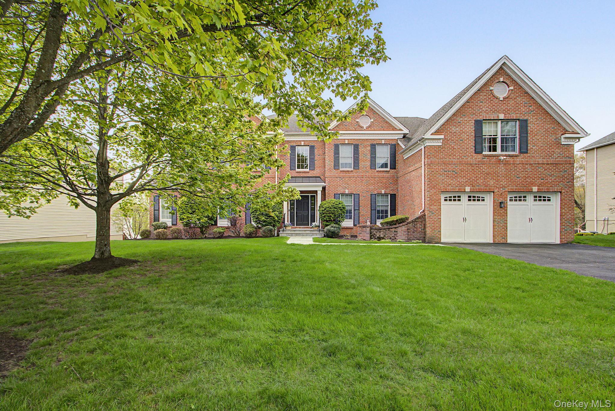 This beautifully renovated brick Colonial blends timeless architecture...