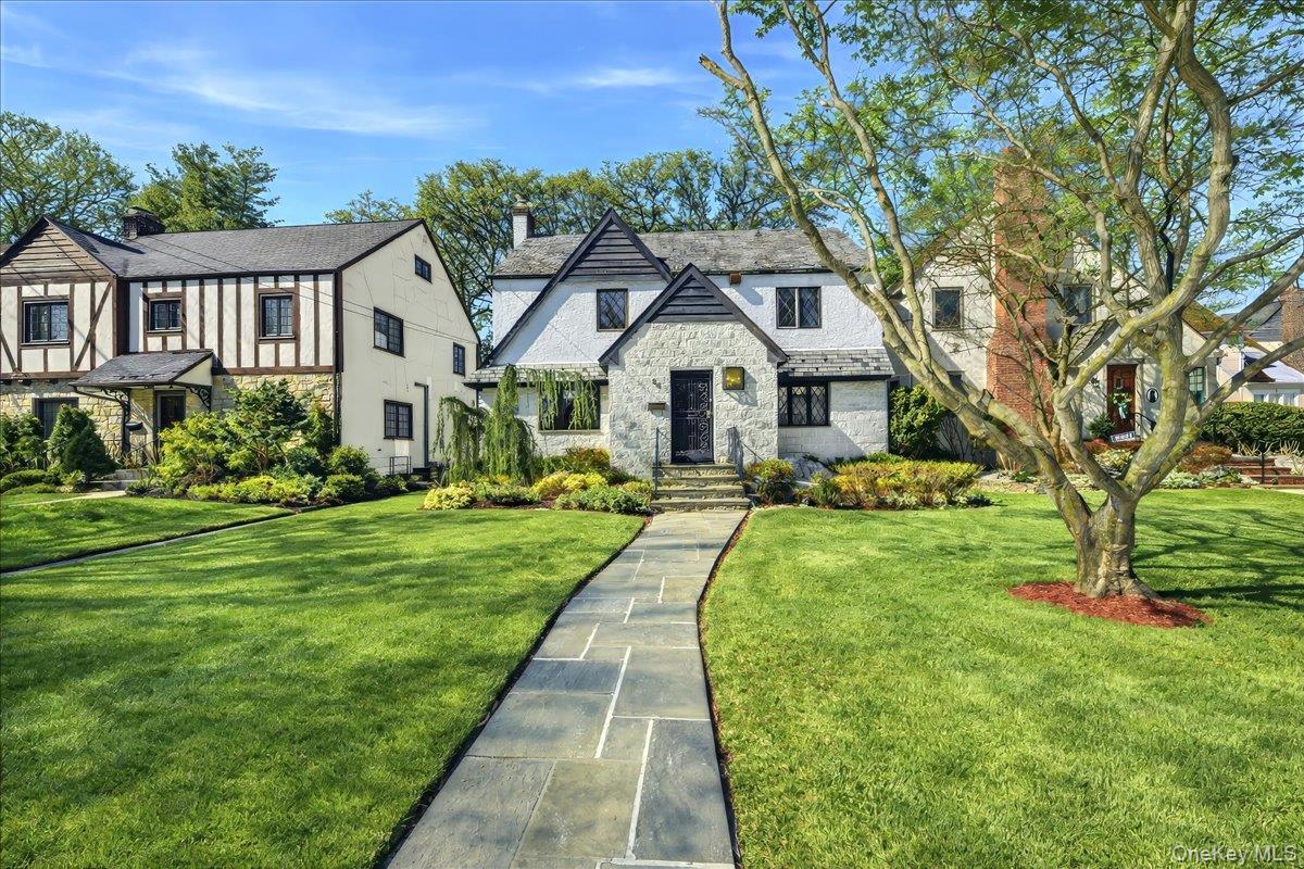In the coveted Hunt Woods neighborhood, you will find this storybook E...