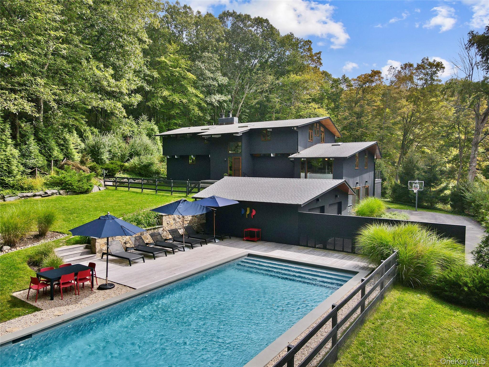 Perfectly turn-key modern stunner available in time to enjoy the pool...
