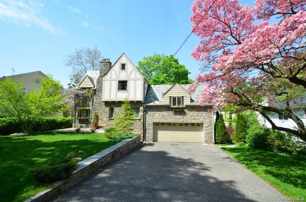 A must see, charming, immaculate 3/4 BRS/ 3.1. BTHS. Stone Front Tudor...