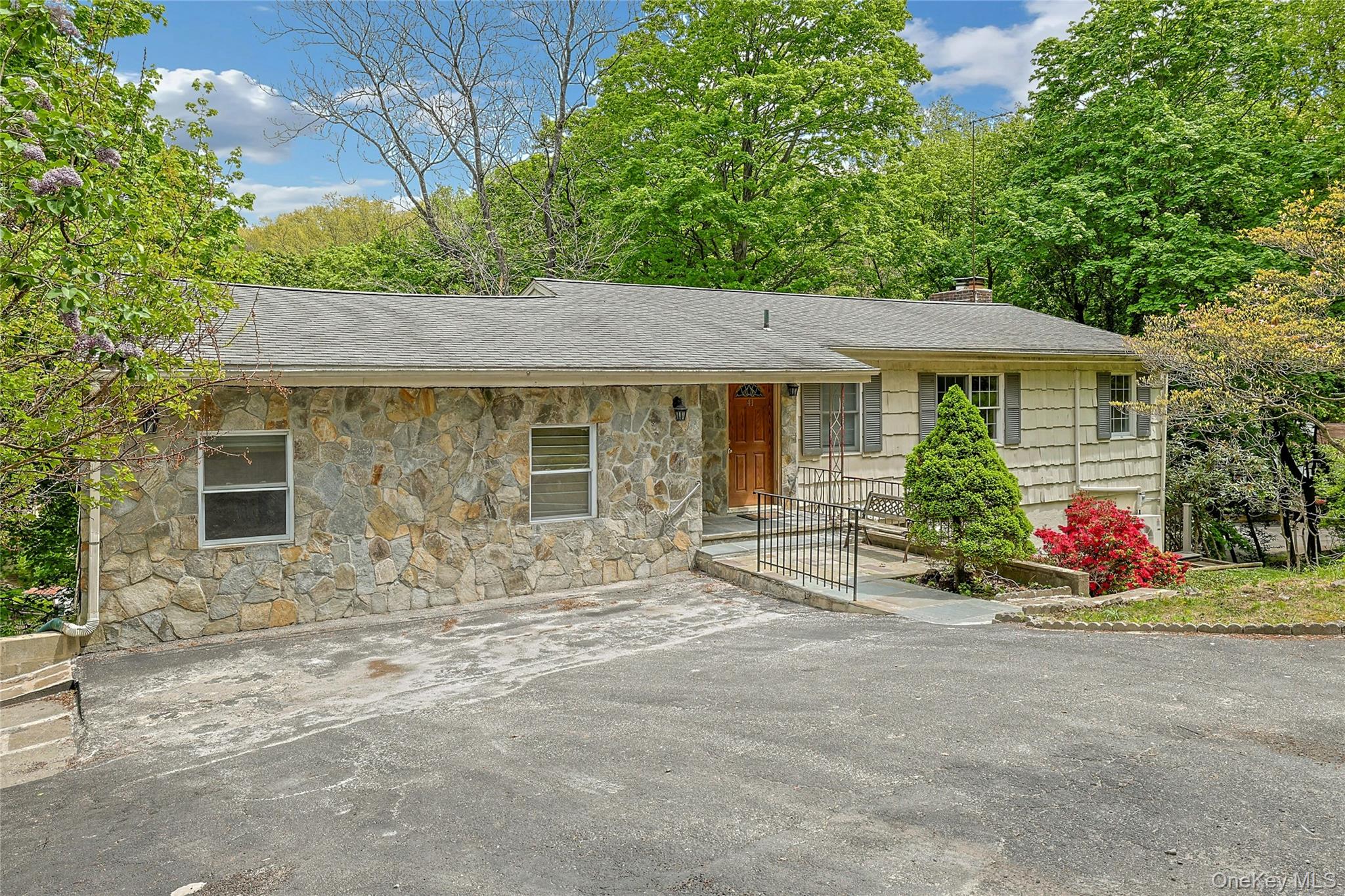 Tucked away on a private half-acre setting, this spacious 4-bedroom, 3...