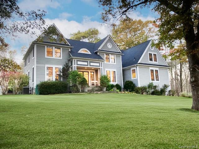 Set gracefully back from the road on 2.29 private acres, this beautifu...