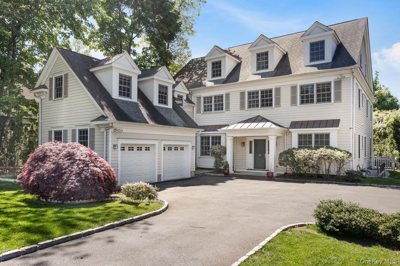 This Fox Meadow colonial residence is stunning!Upon entry, visitors ar...