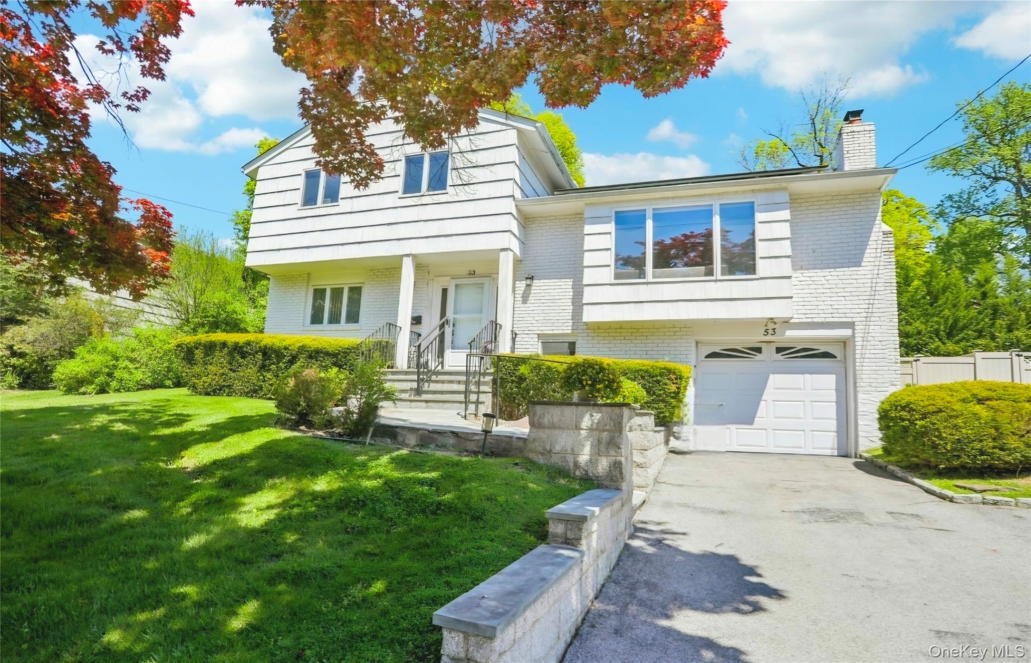 Bright and spacious 4-bedroom, 3-bath split-level home with an open la...