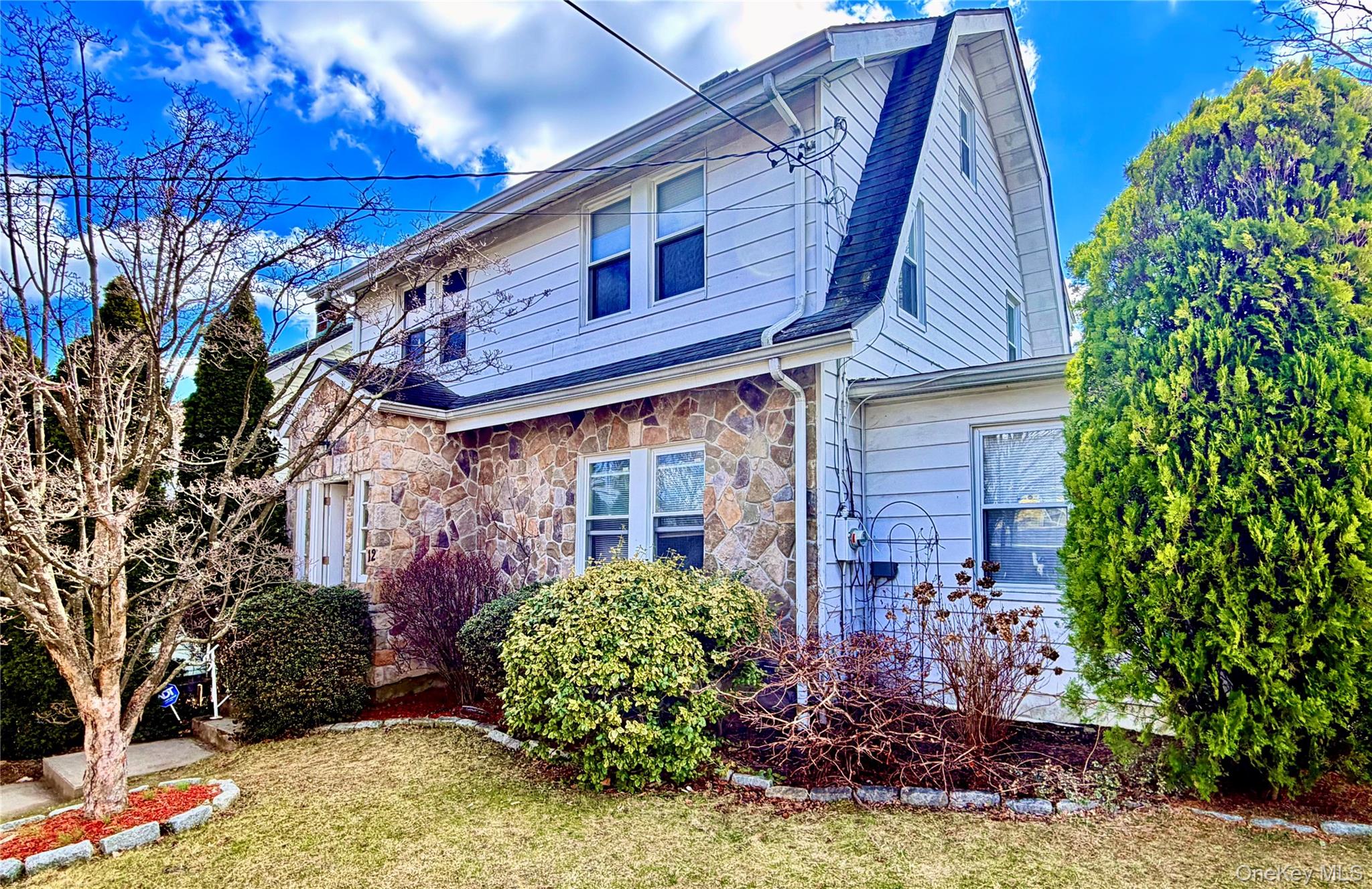 Set on a sunny corner lot in the heart of Port Chester, 12 Irenhyl Ave...