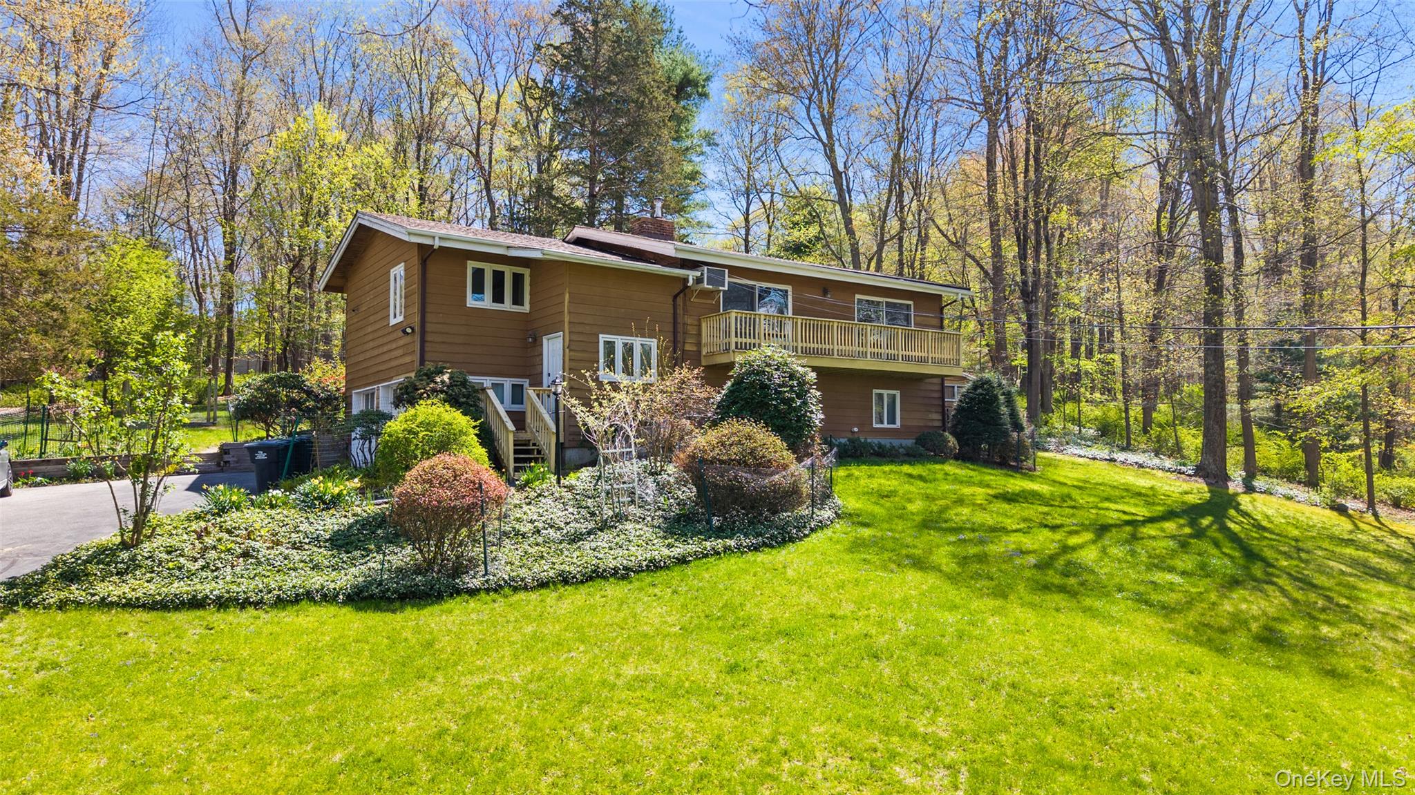 Western View. Over one park-like acre with rolling lawns, flowering pl...