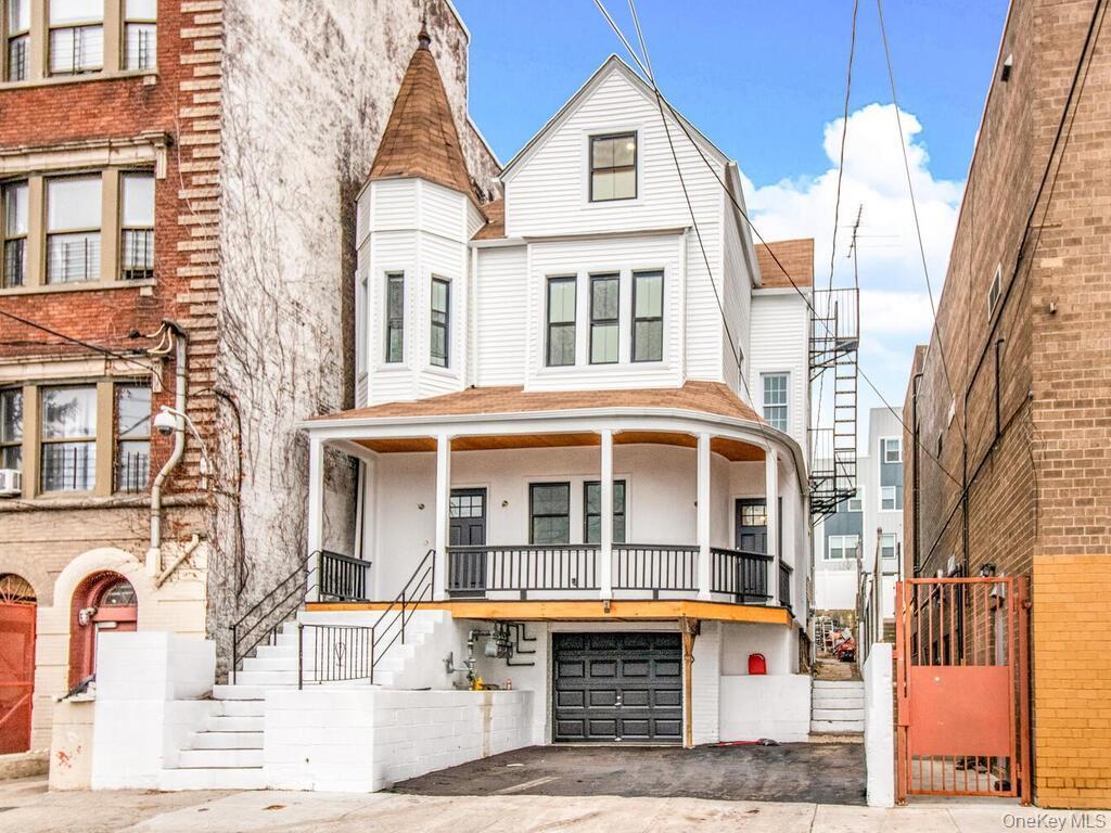 Experience serene riverside living at 154 Woodworth Avenue. This charm...