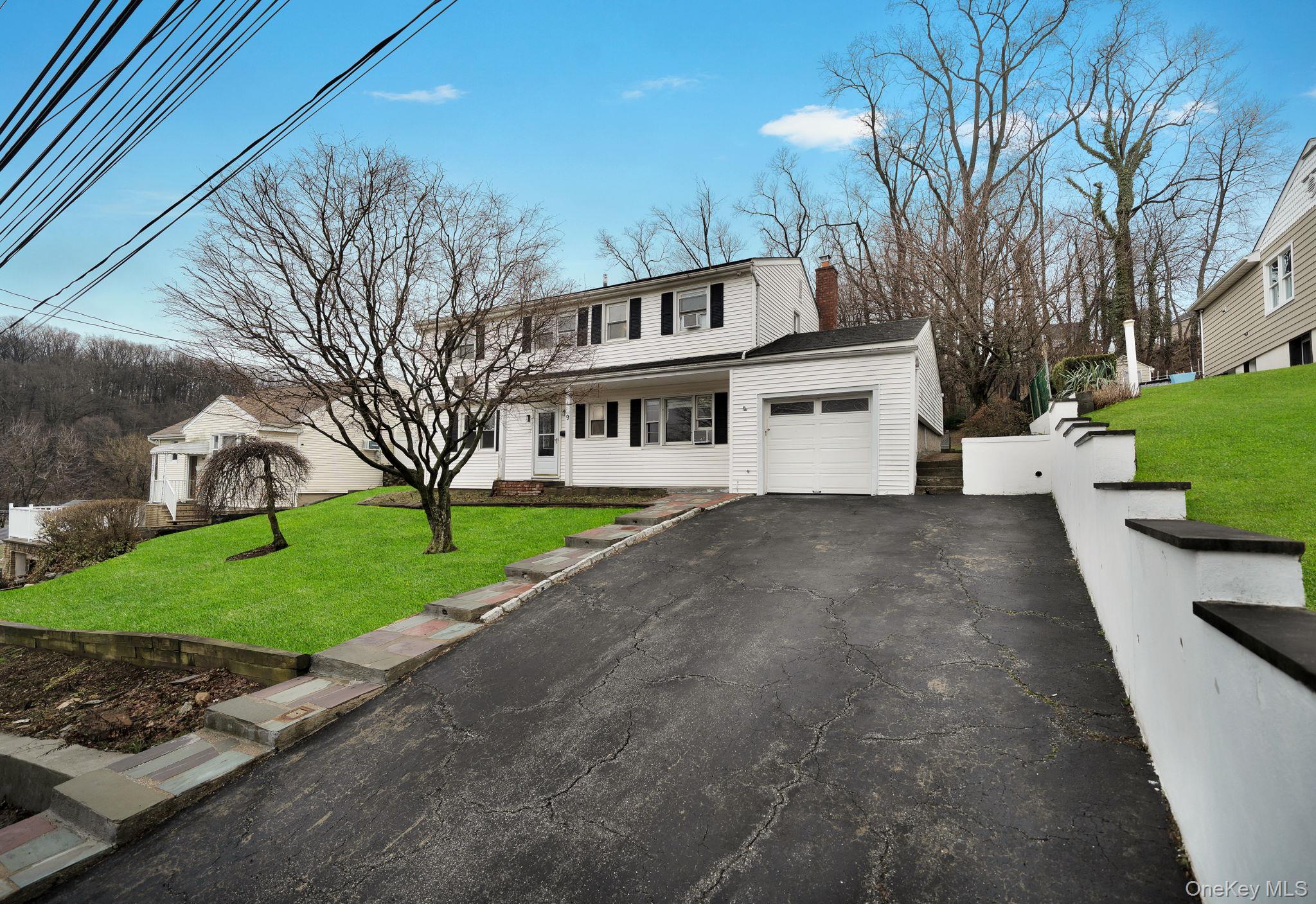 Welcome to 9 Valley View Drive in Yonkers, a beautifully maintained si...