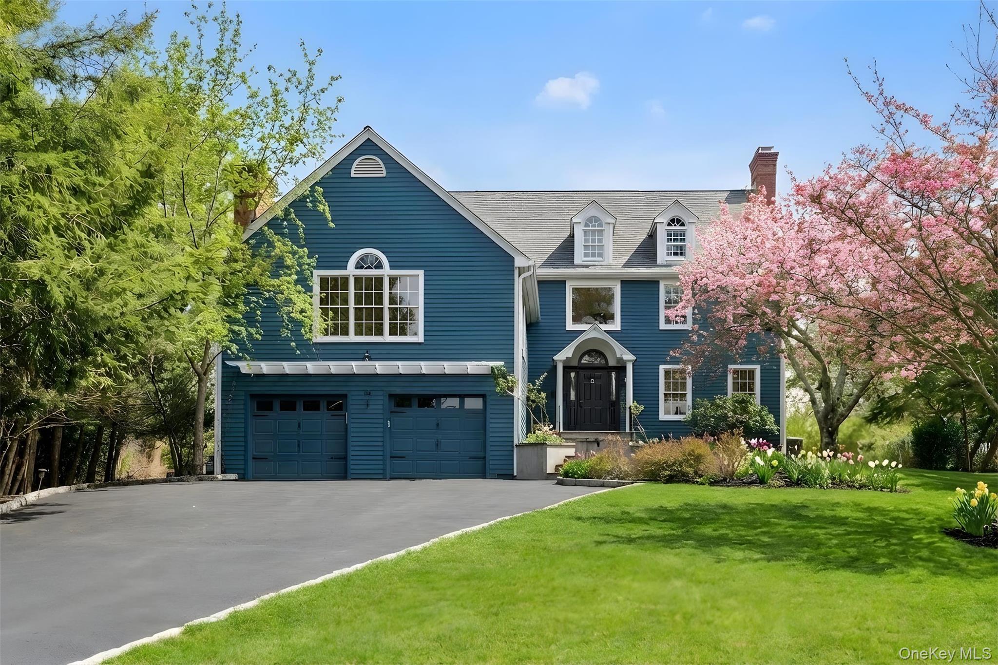 Beautifully sited on .43 acres along a quiet, desirable street, this e...