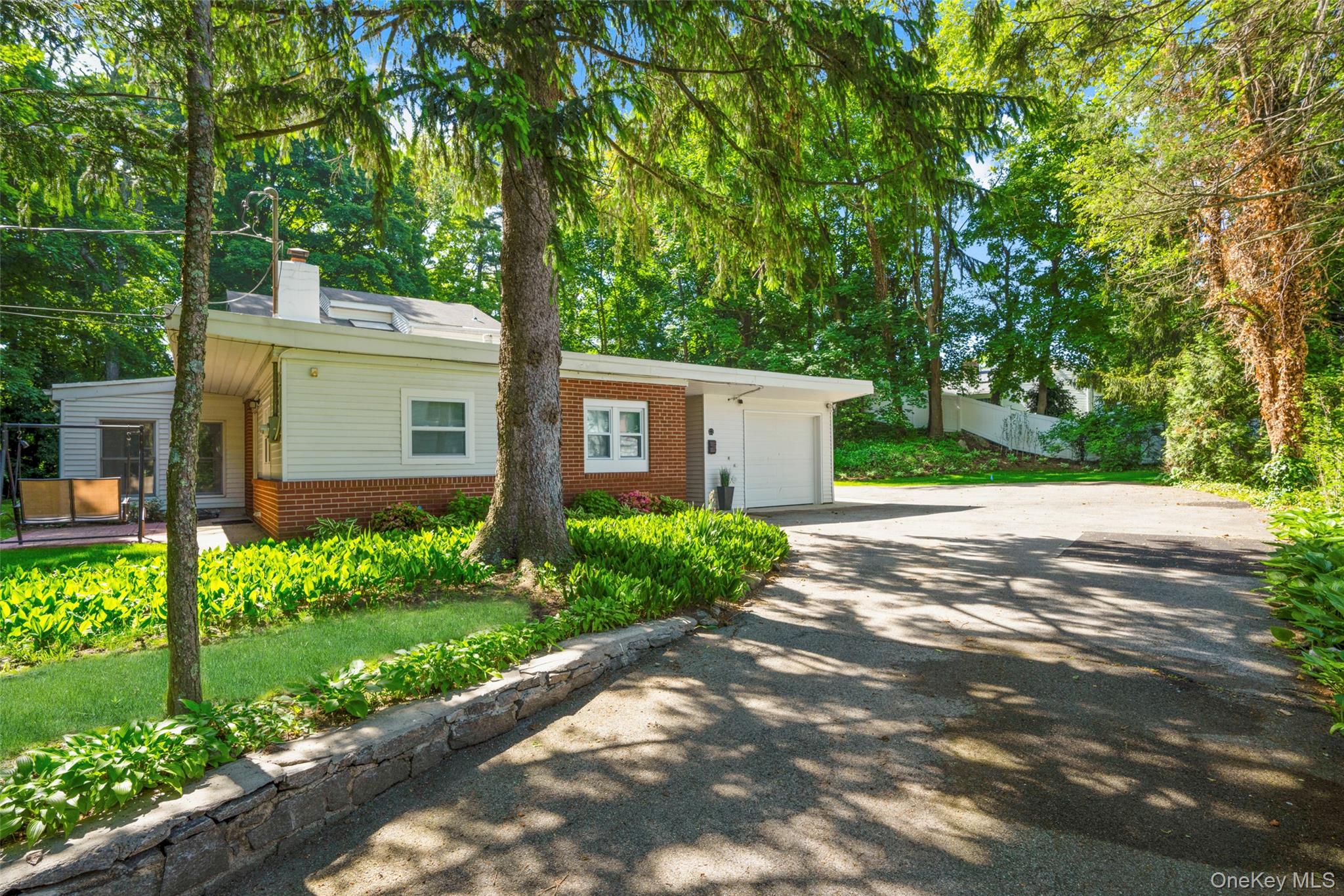 Nestled in a tranquil setting, this mid-century, sun-drenched residenc...
