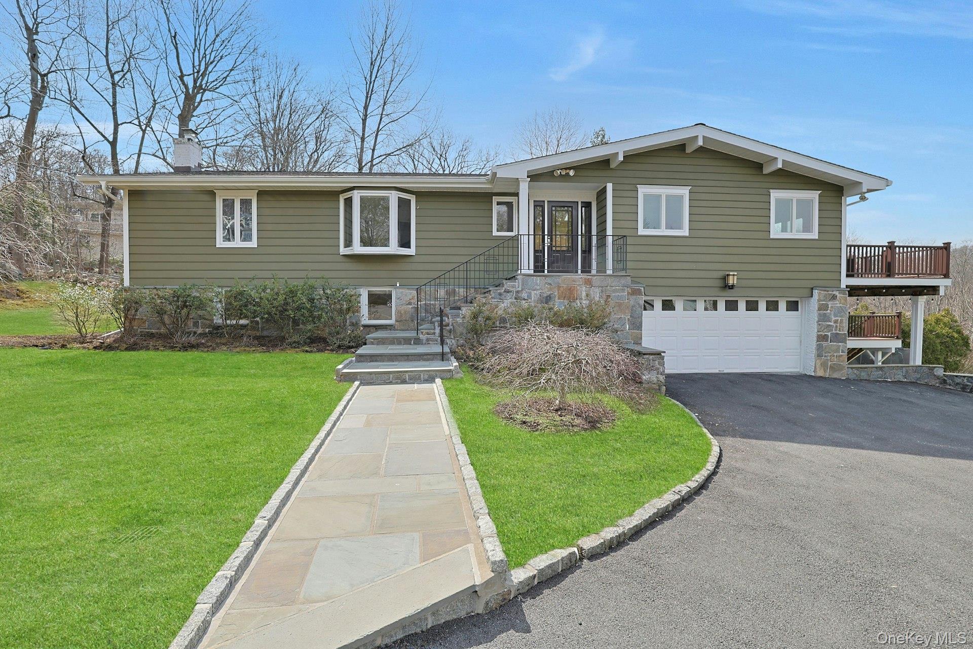 Set on nearly a full acre of beautifully landscaped property and exten...