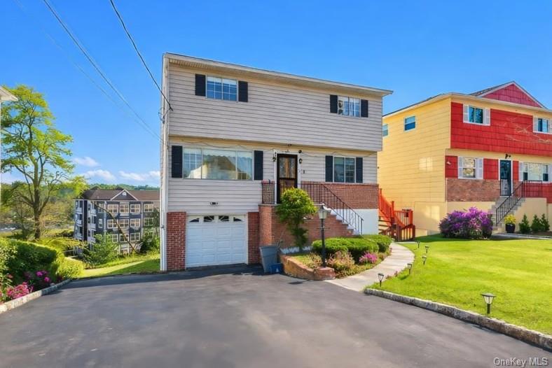 Colonial single-family residence featuring a spacious layout with brig...