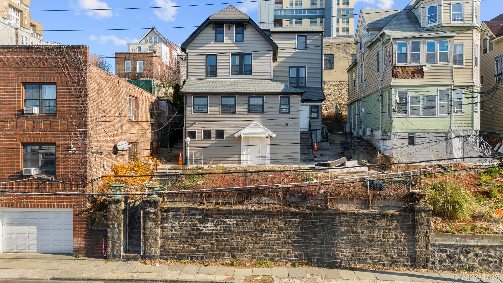 investment opportunity on Buena Vista Ave in Yonkers! This unique 3 un...