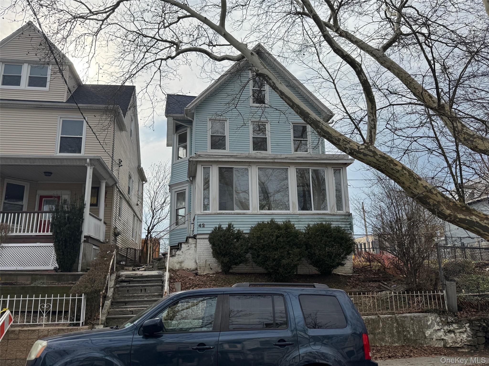 Detached 2.5 story home with an unfinished basement close to the train...