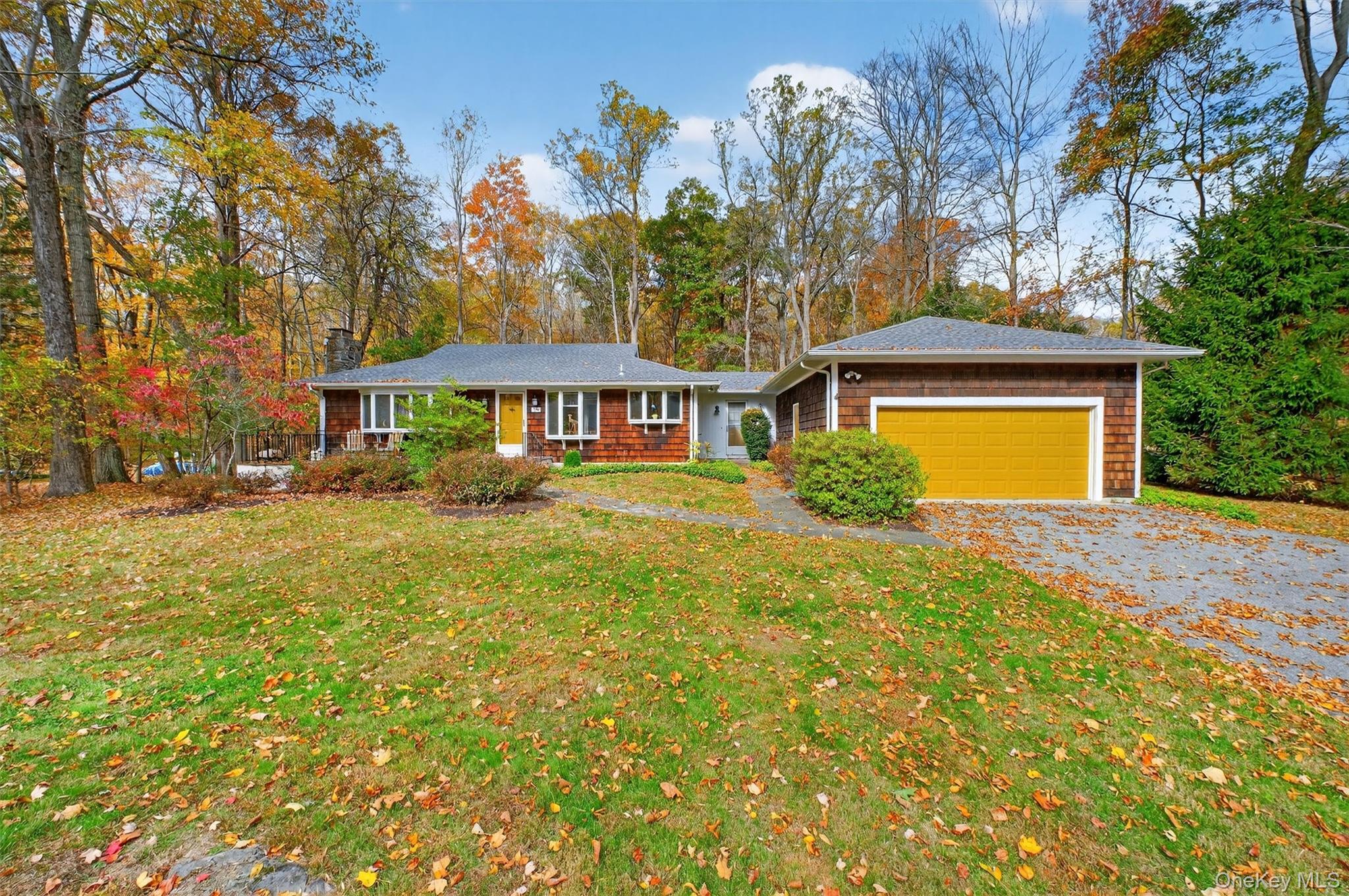 Charming Country Ranch-style home set on private 1+ acre adjoining Bri...