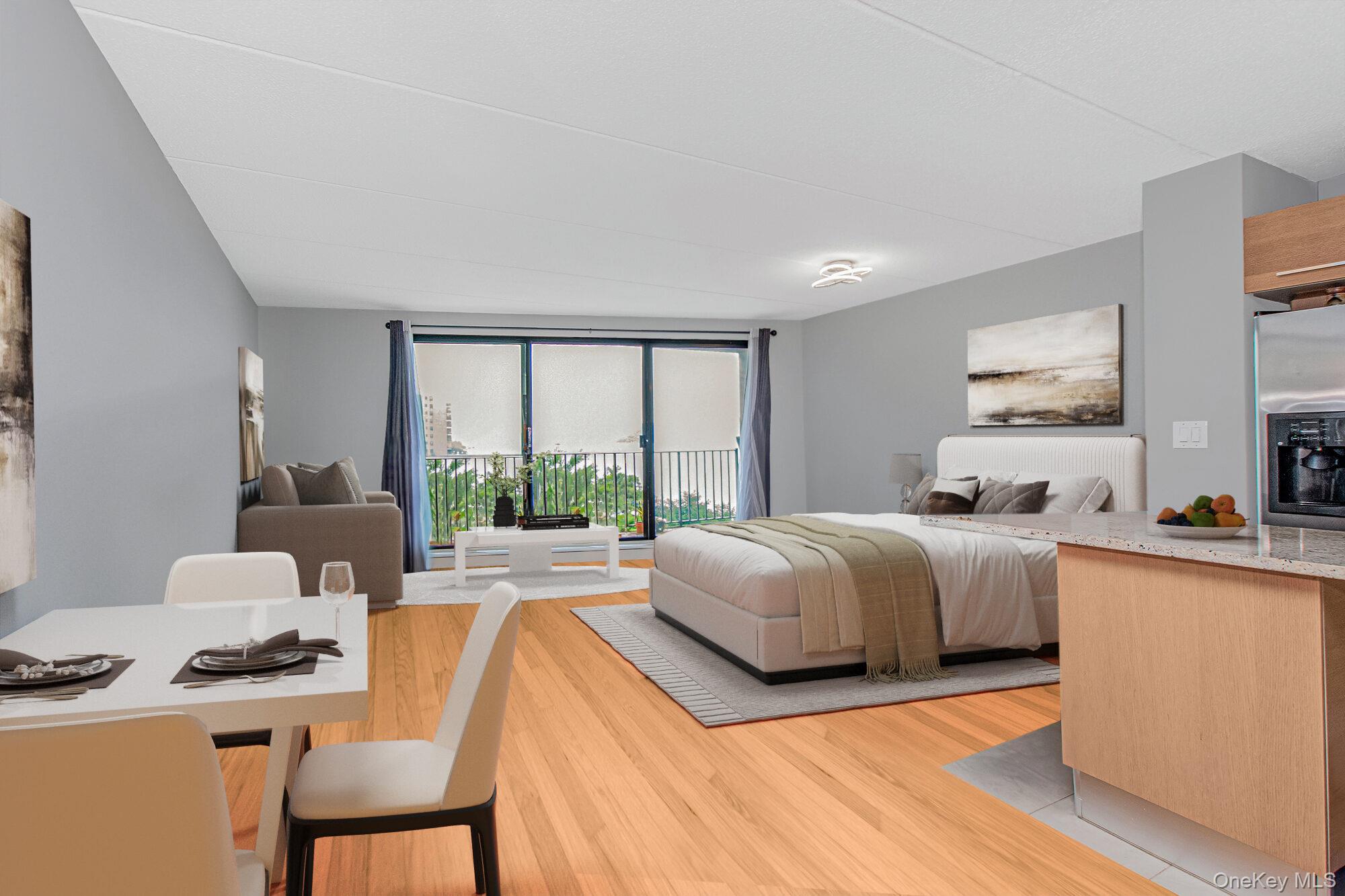 Sunlit waterfront studio rental with a private balcony showcasing Huds...