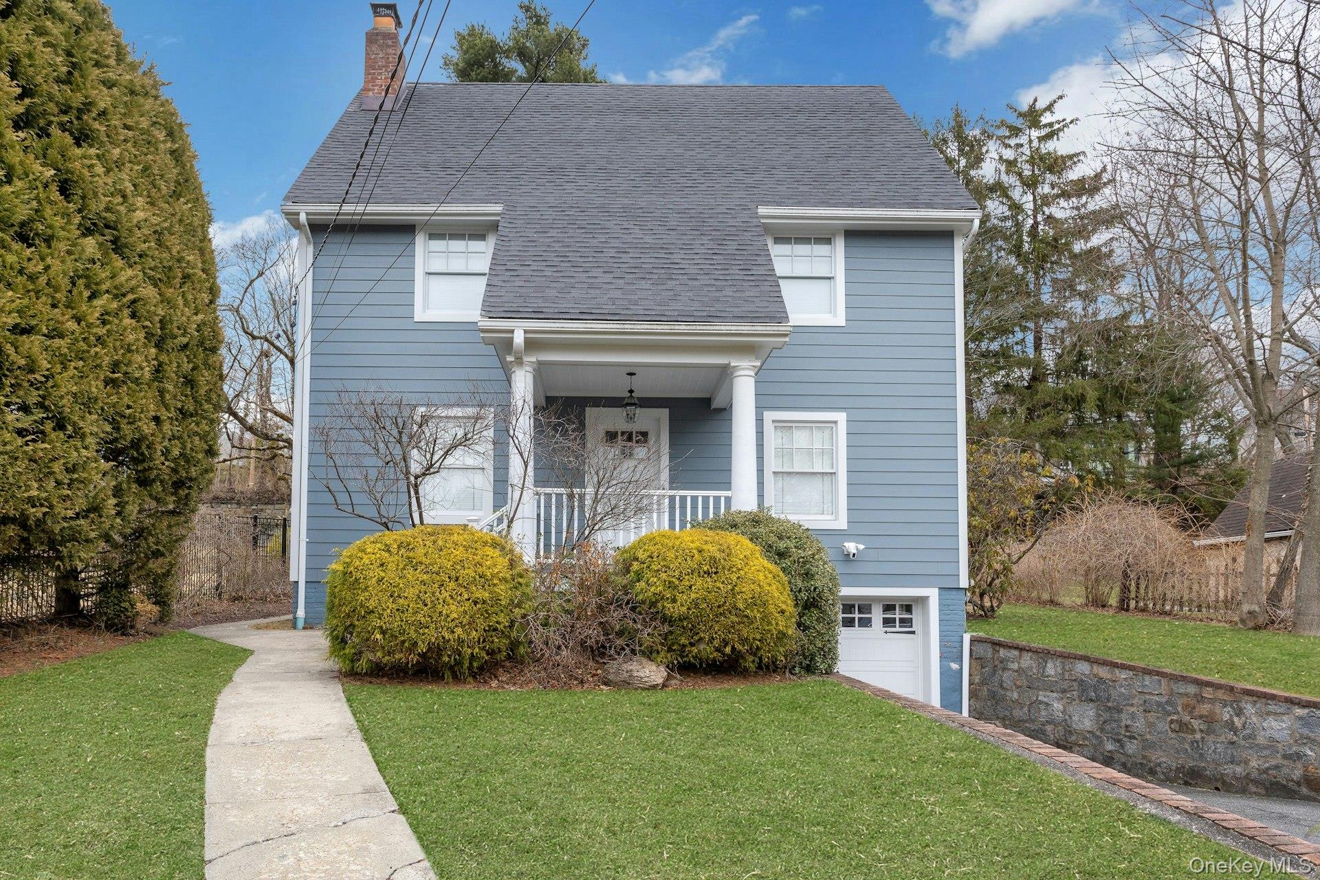 This sunny 1920's Colonial-style home in the desirable Walgrove Park n...