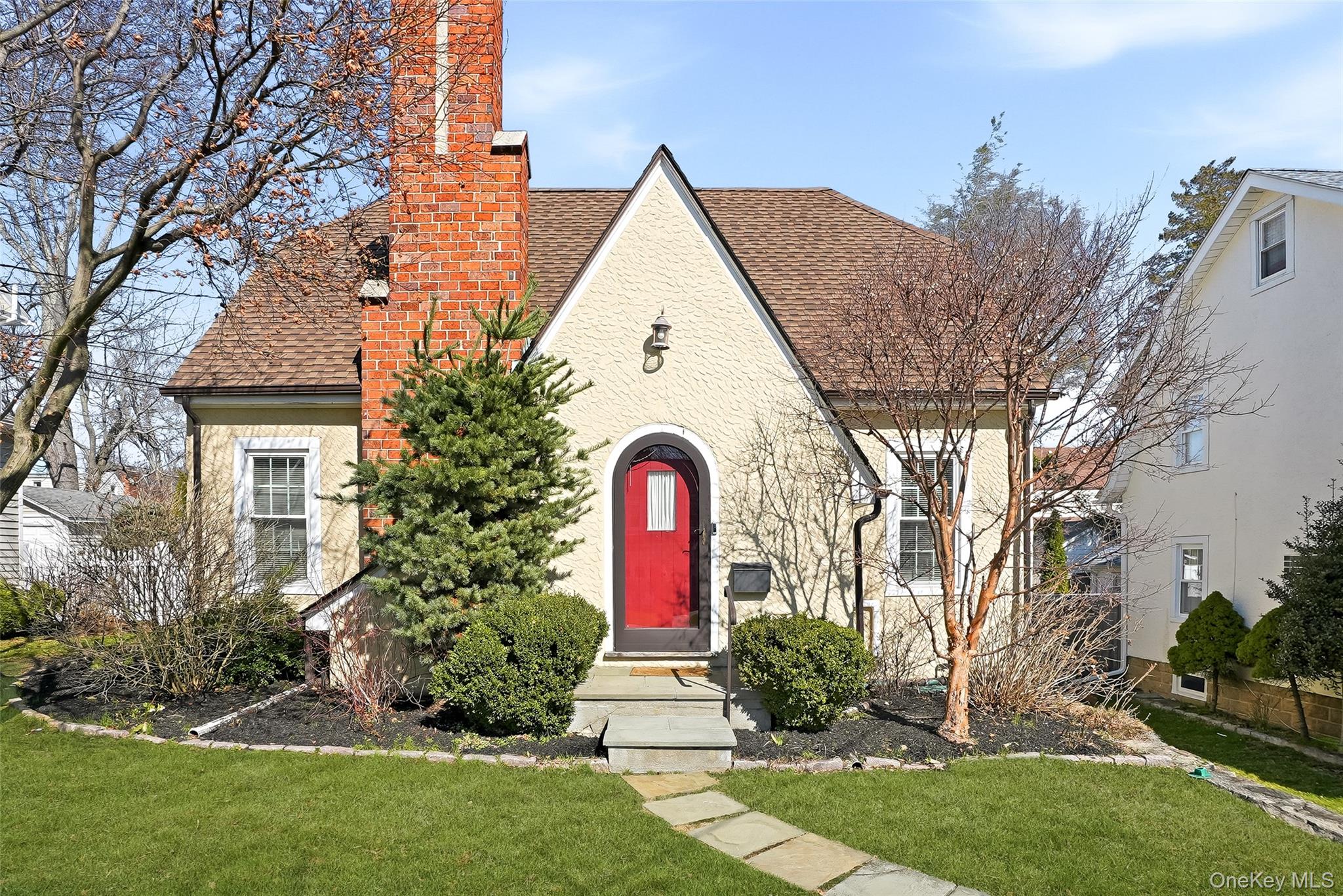 Charming and picture-perfect, this classic Tudor offers timeless chara...