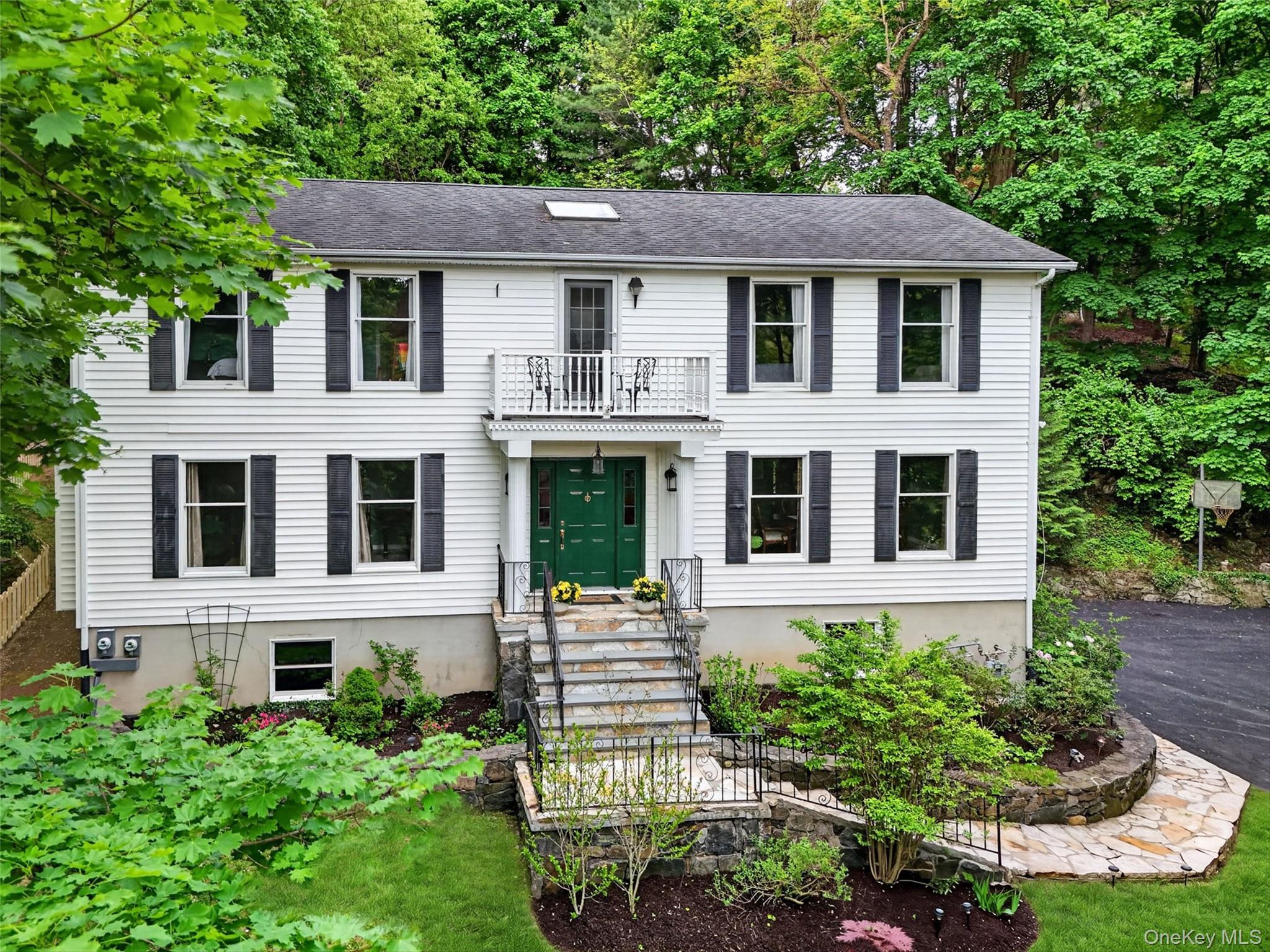 Perched above the Upper Village on over a half-acre, this classic cent...