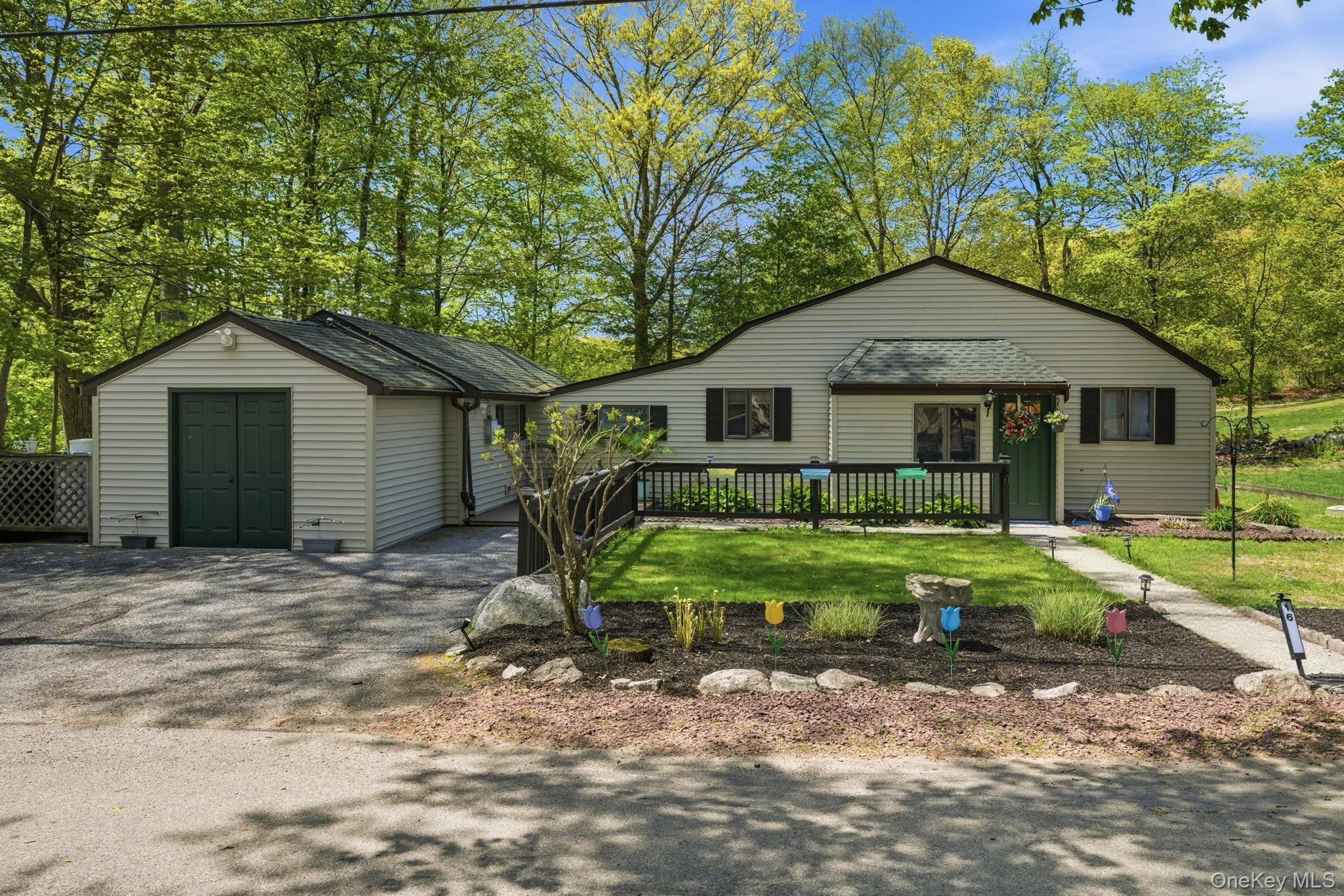 Tucked into a single-family community on Peach Lake, this updated thre...