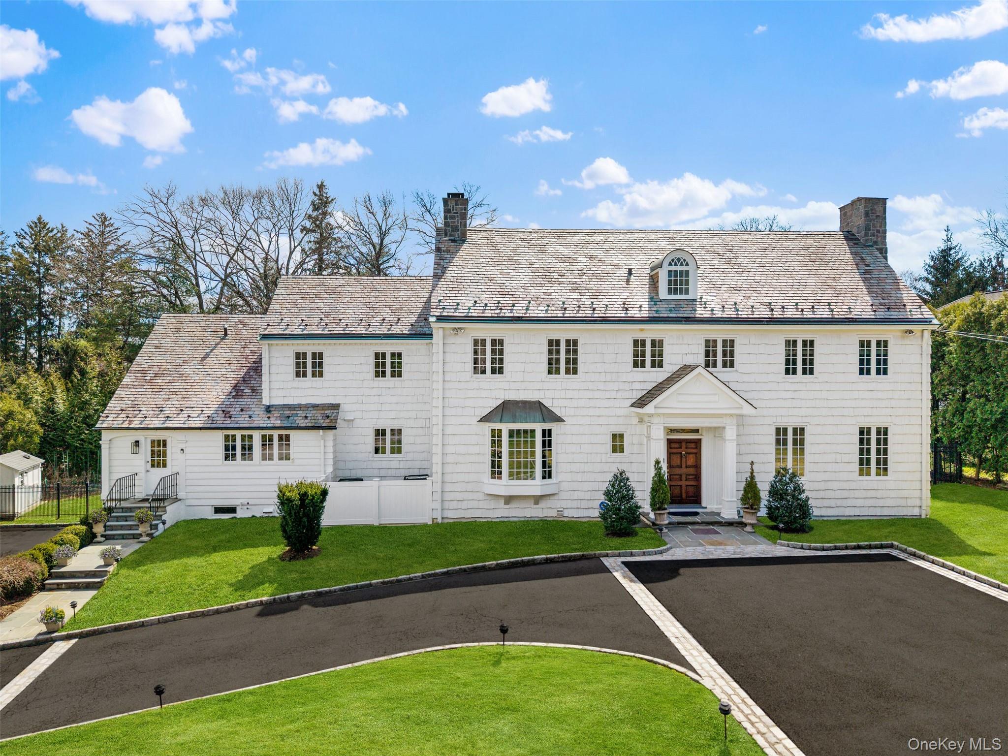 A beautifully move-in ready Colonial set on a private, park-like .61-a...